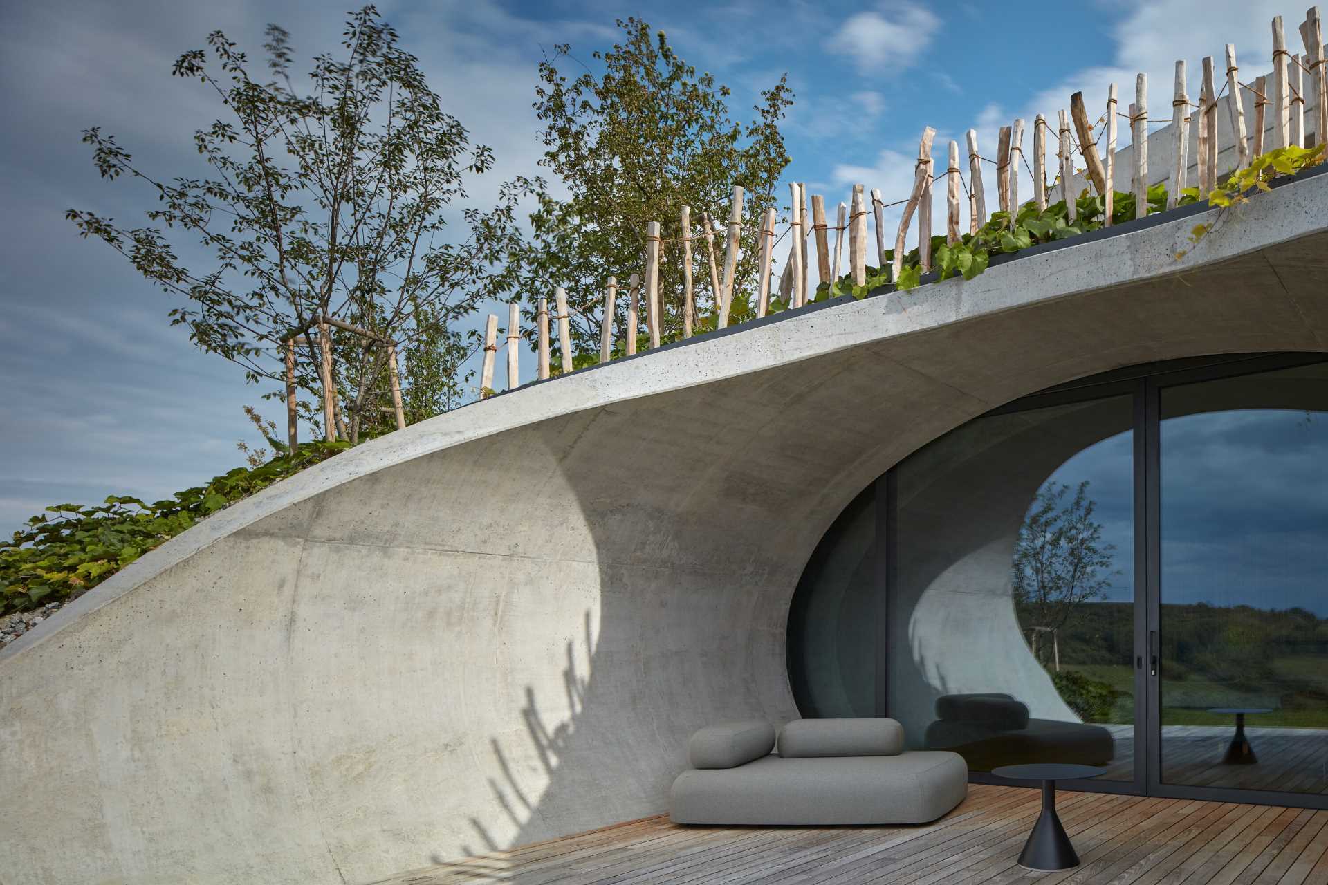 This winery hotel room has its own unique rounded design, with doors that open to a semi-private patio with views of the vineyard.