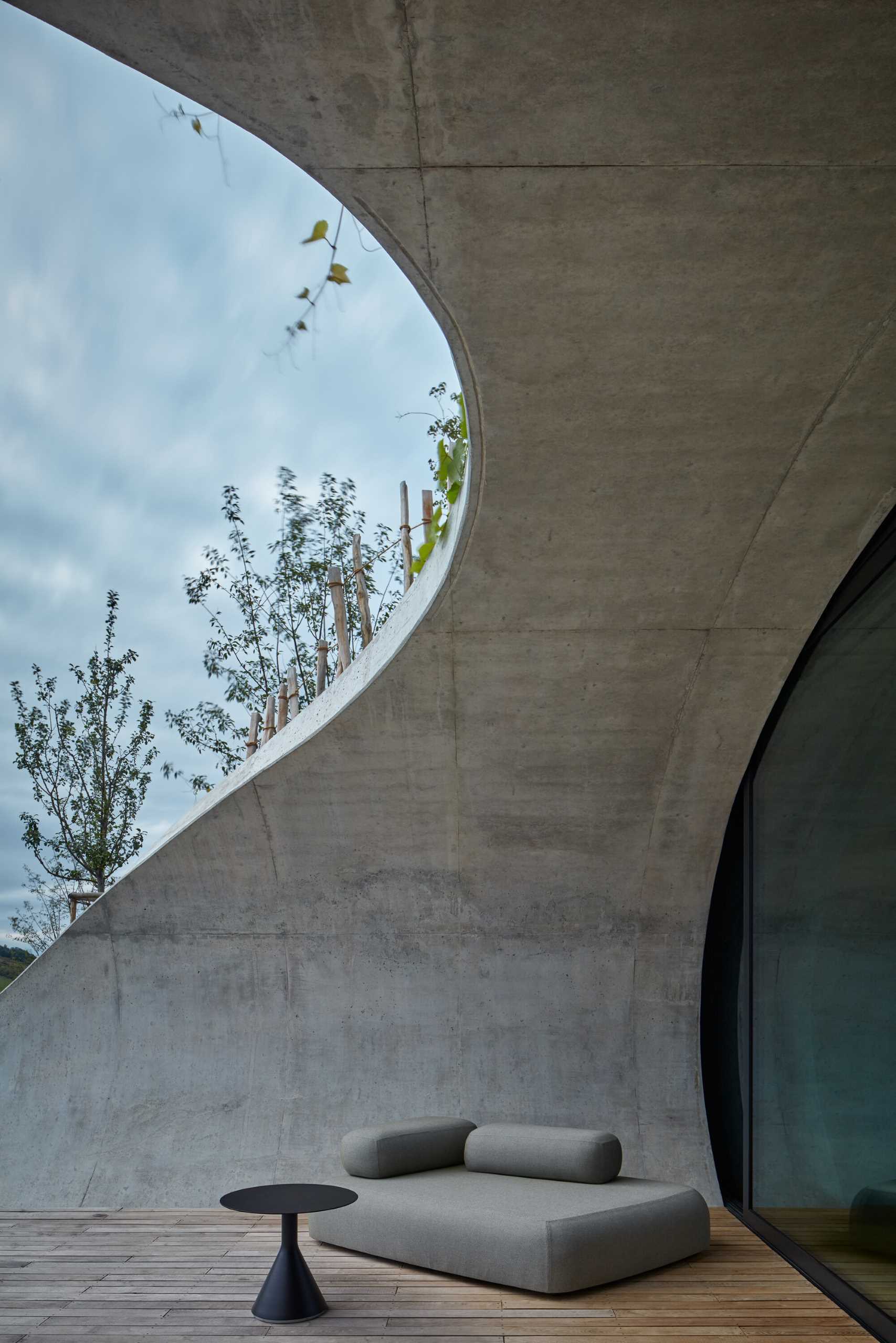 This winery hotel room has its own unique rounded design, with doors that open to a semi-private patio with views of the vineyard.