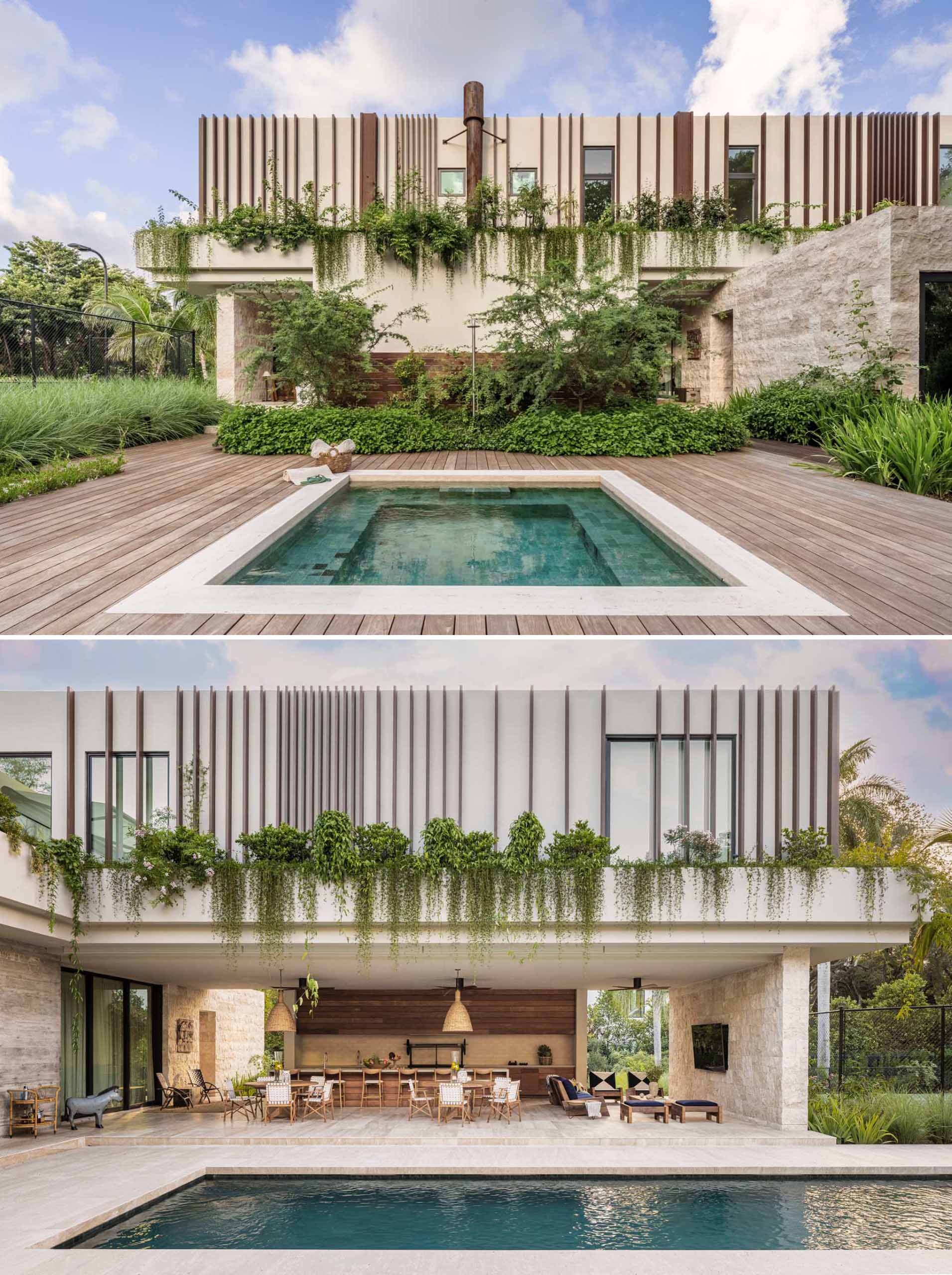 The H-shaped layout of the home forms a protected courtyard for the pool, which extends into the rear yard.