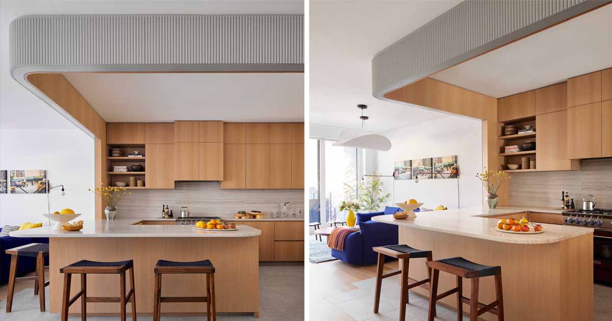 This modern kitchen has been wrapped in textured wood and painted blue-grey.