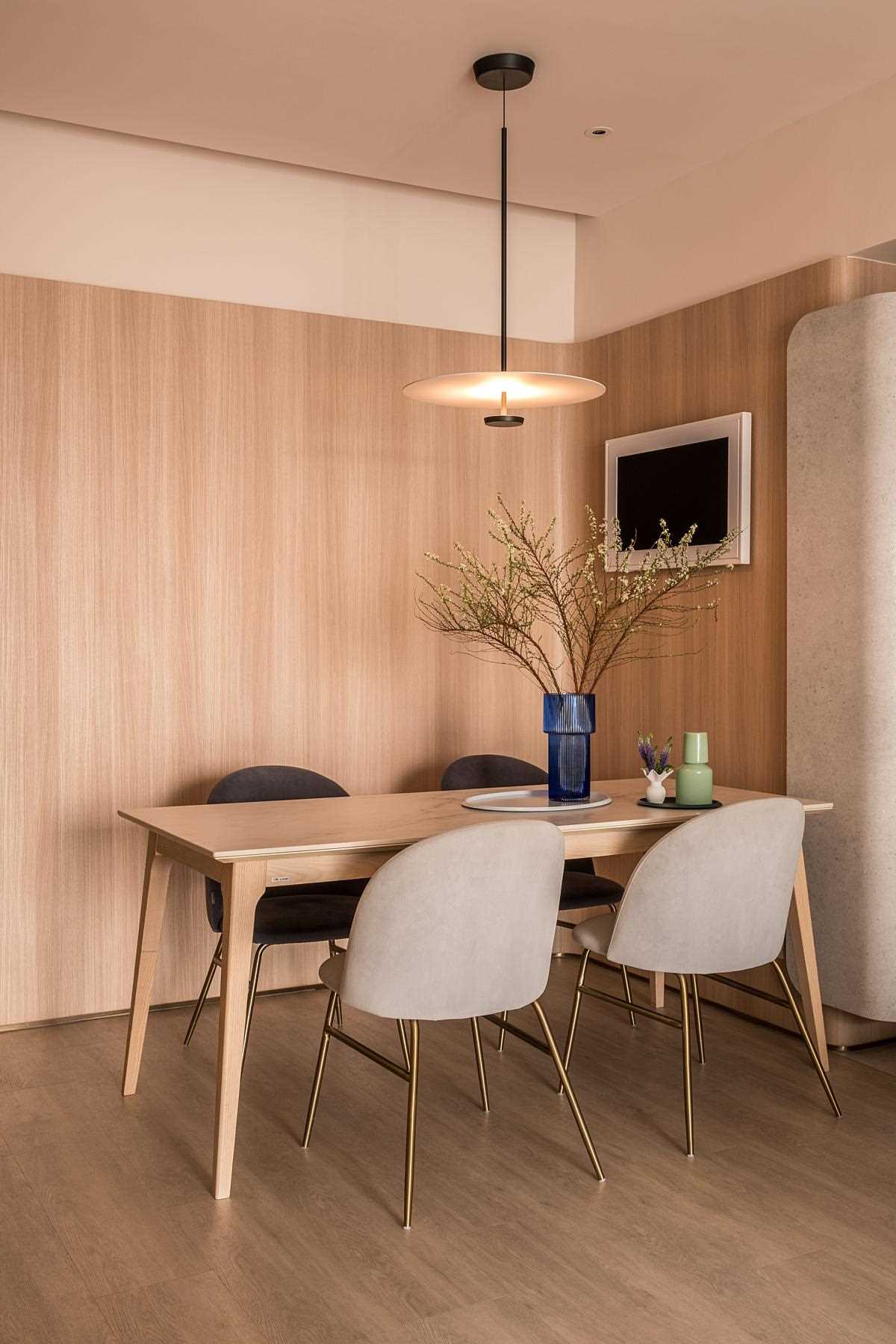 A modern living room with a continuous wood accent wall.