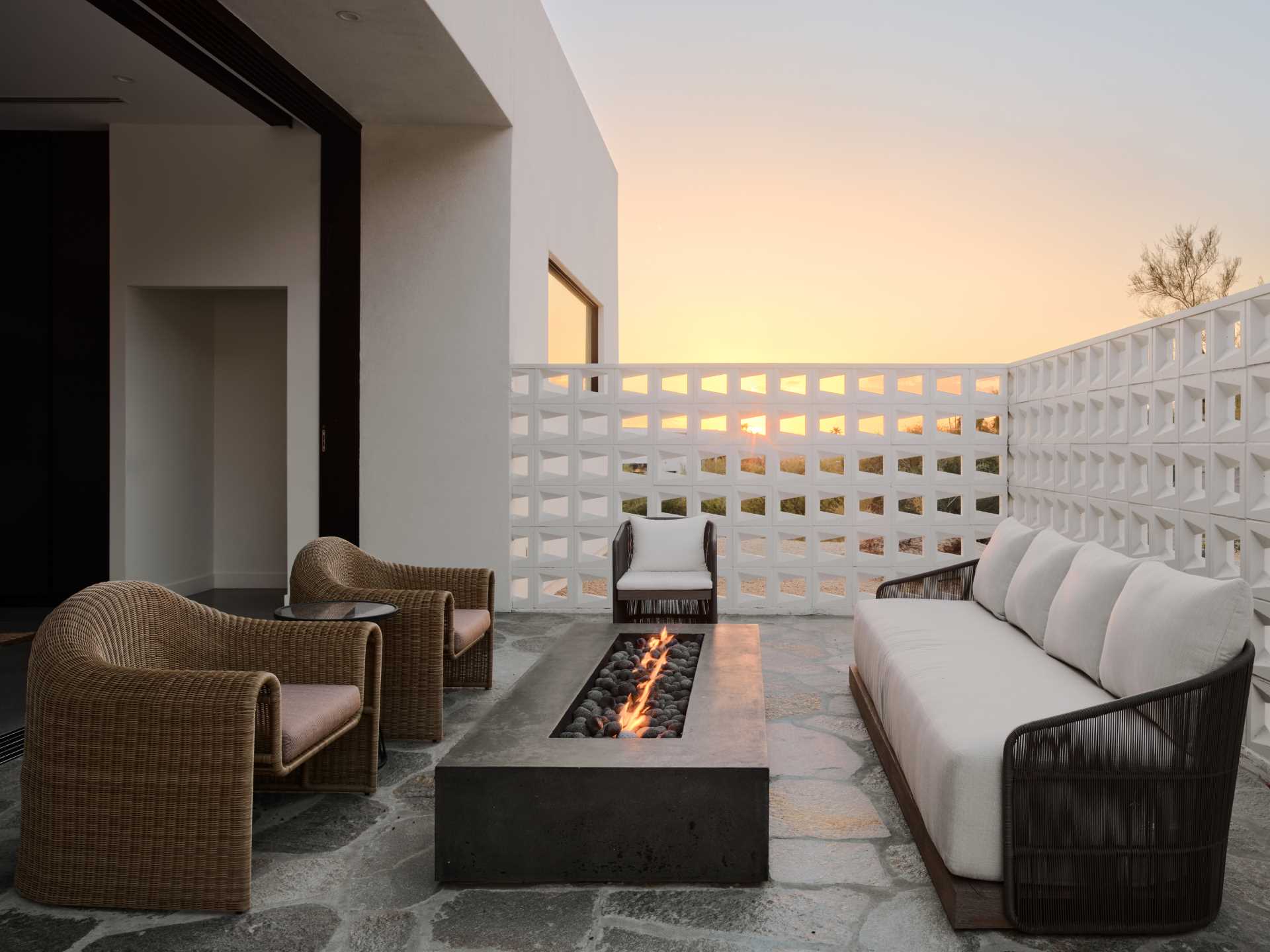 A desert home with patio that has privacy provided by mid-century modern inspired breezeblocks.