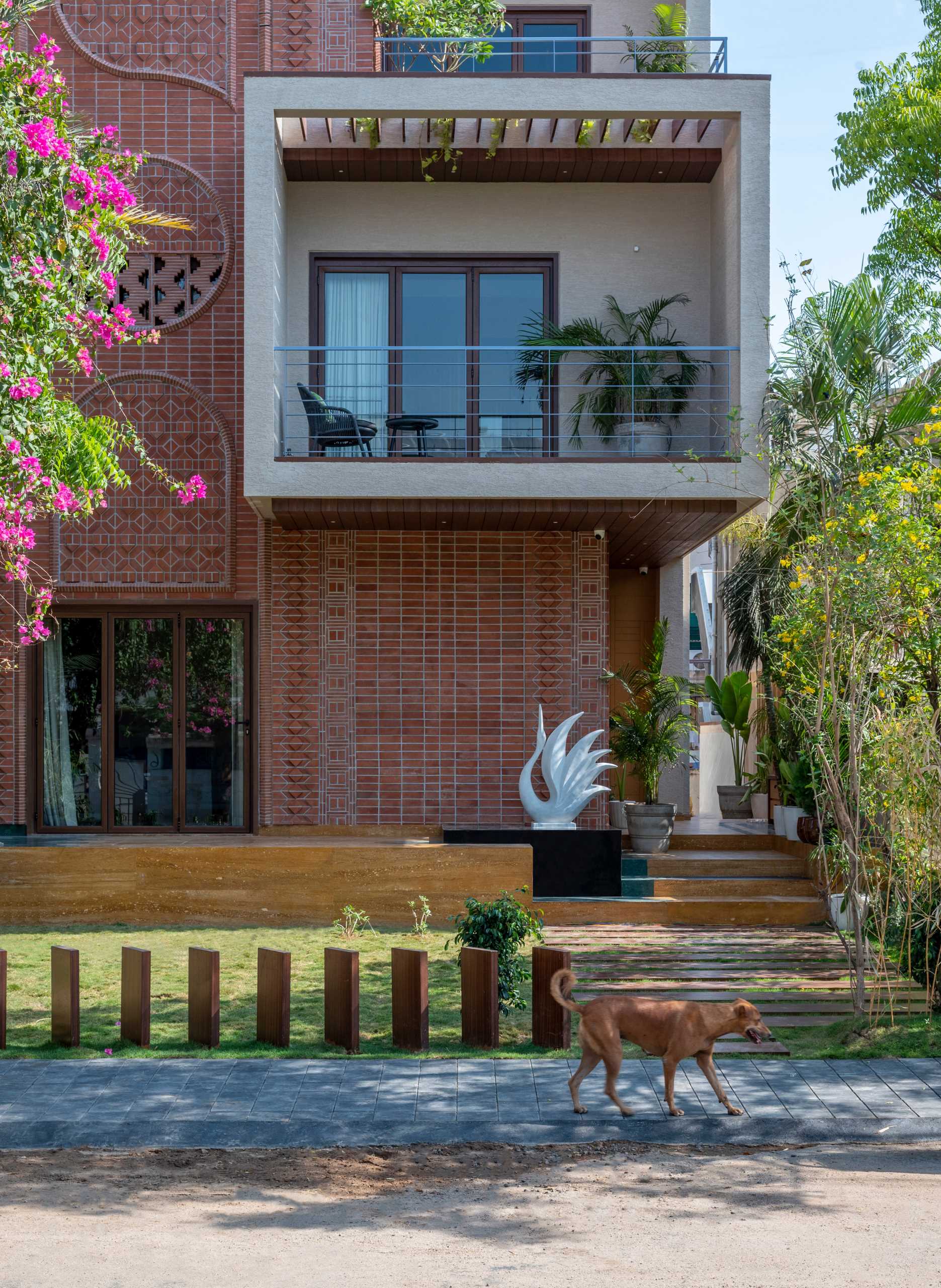 A modern home facade with a variety of brick patterns and unique designs.