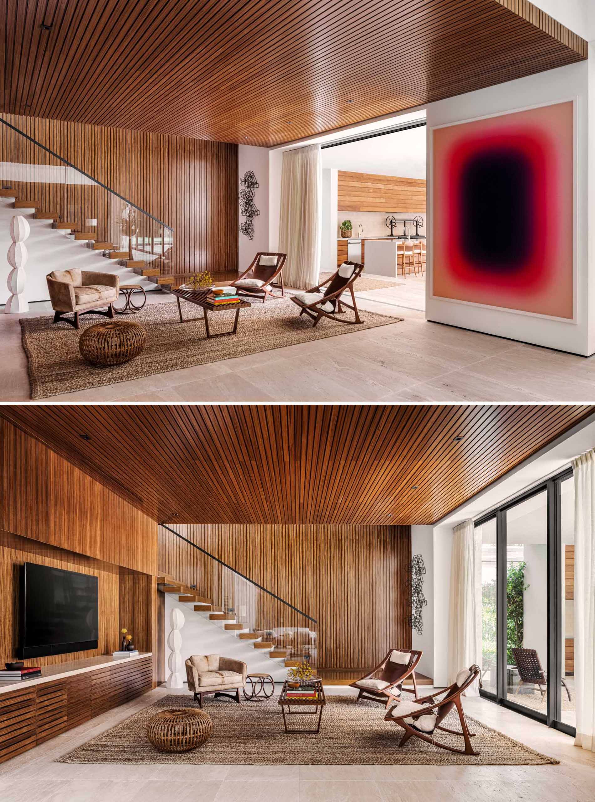 You can see the home's Brazilian influences and vintage touches in this living room, which include Sergio Rodrigues chairs, teak paneling, and oak stairs. A pop of color has been added with the inclusion of a Jonny Niesche piece.