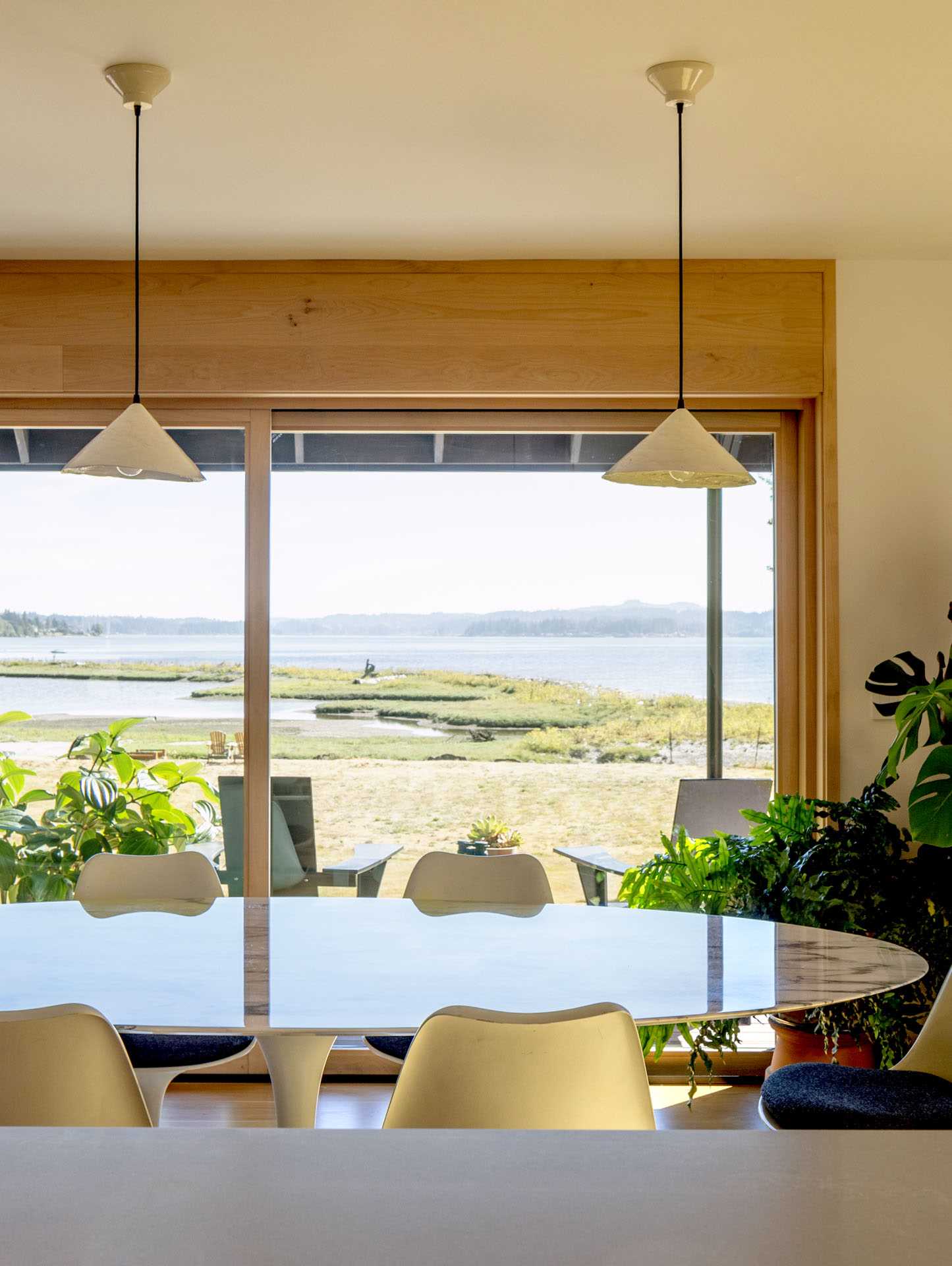 A contemporary open plan dining area with water views.