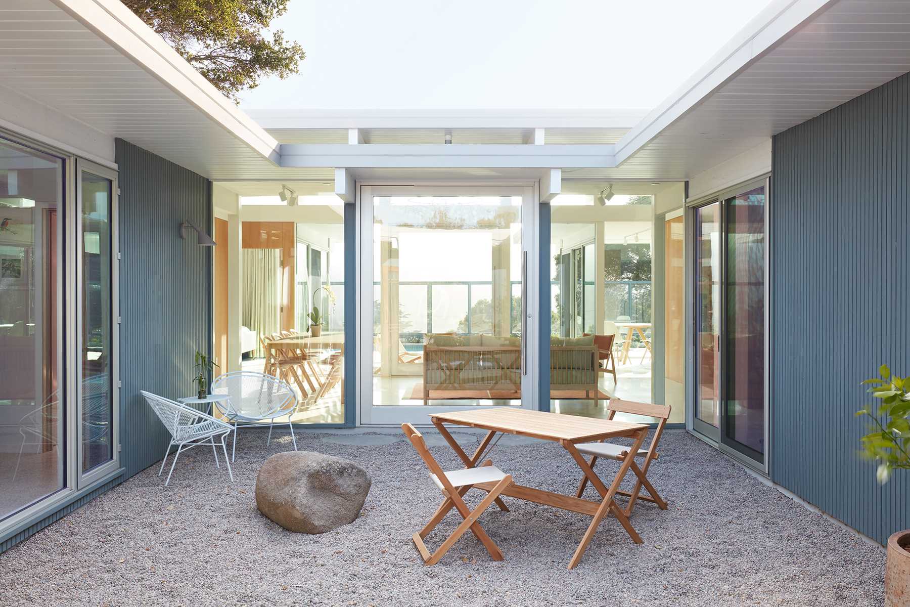 A remodeled Eichler home with a courtyard.