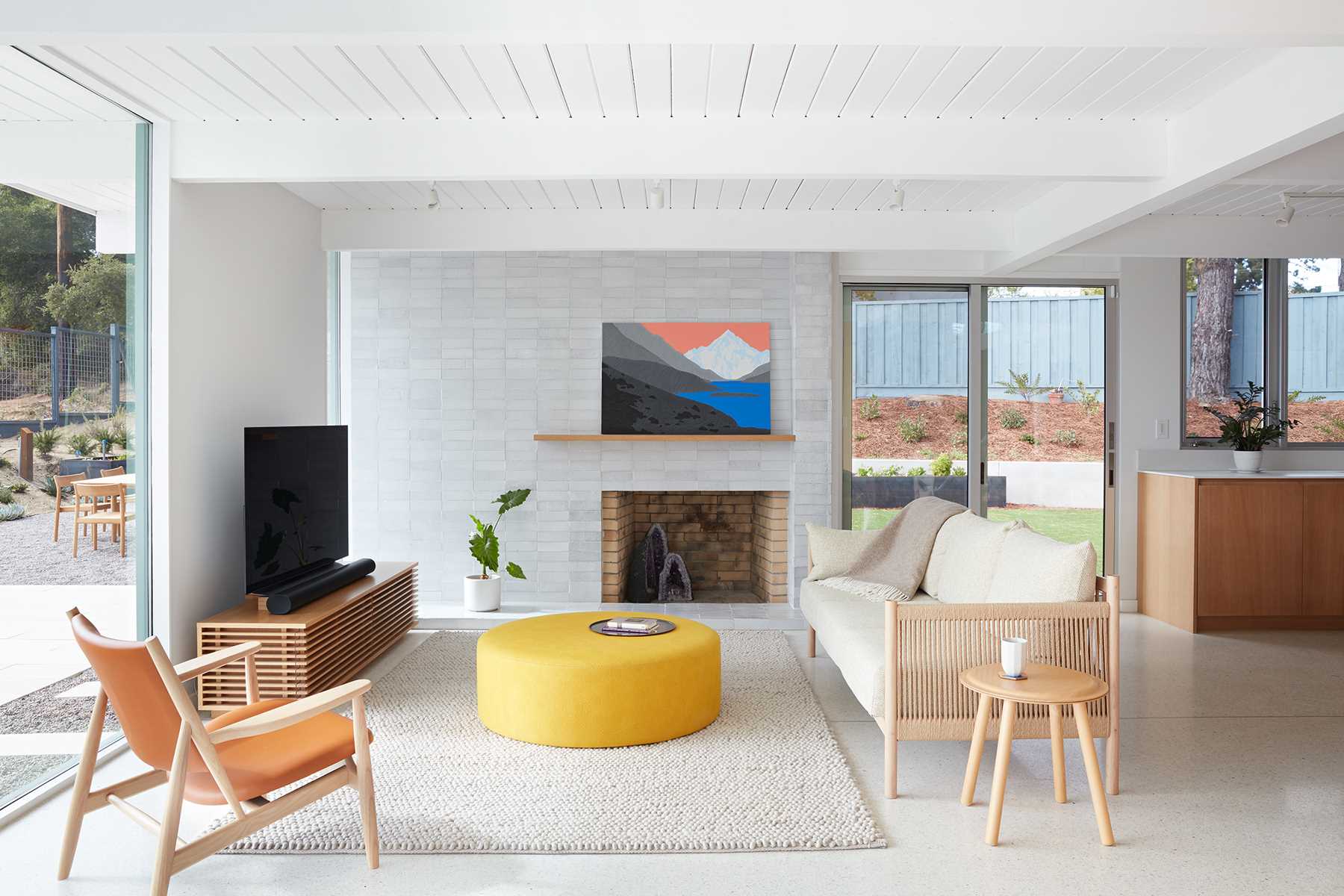 A remodeled Eichler home with a fireplace.