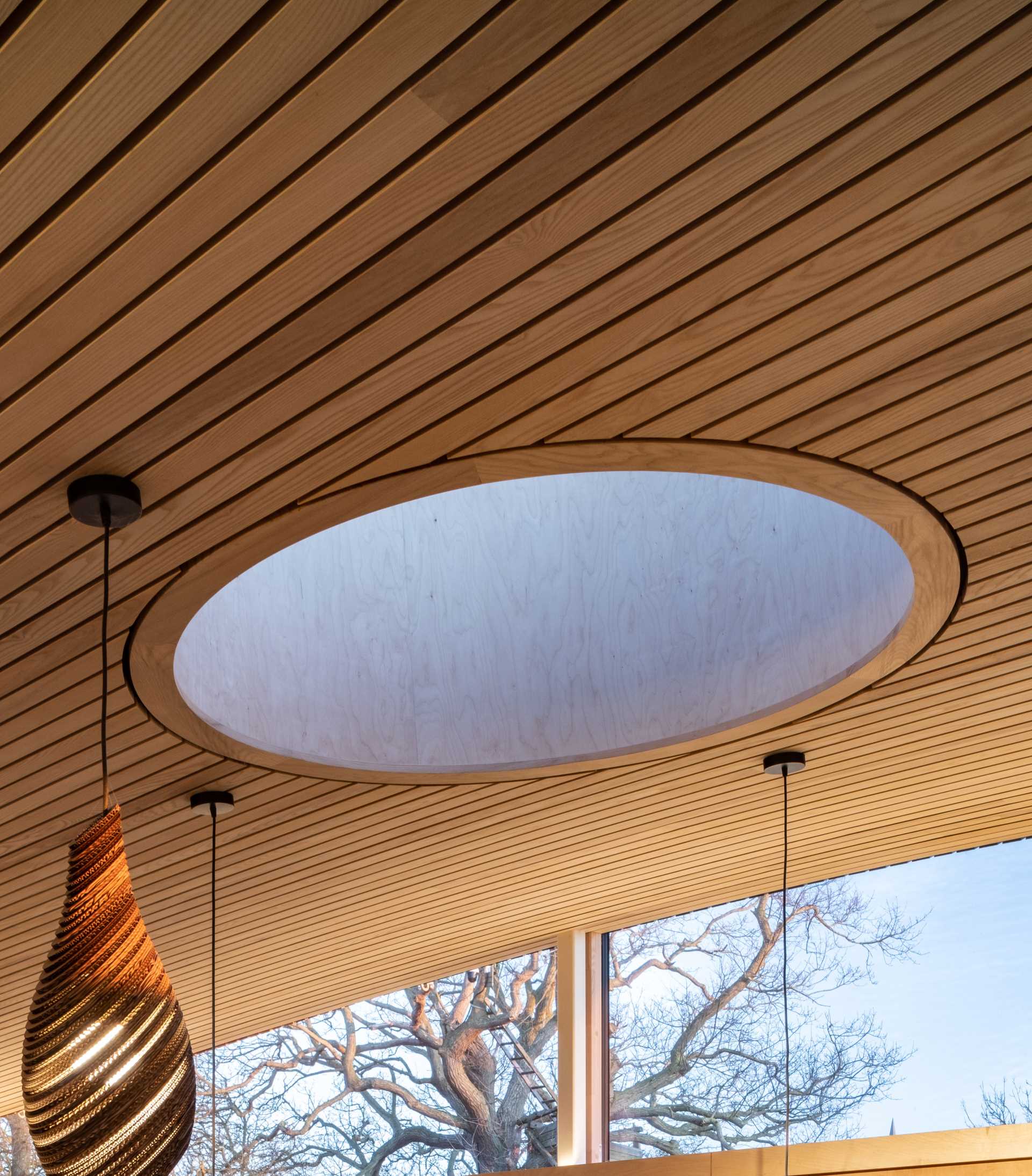 A round skylight in a contemporary cabin.