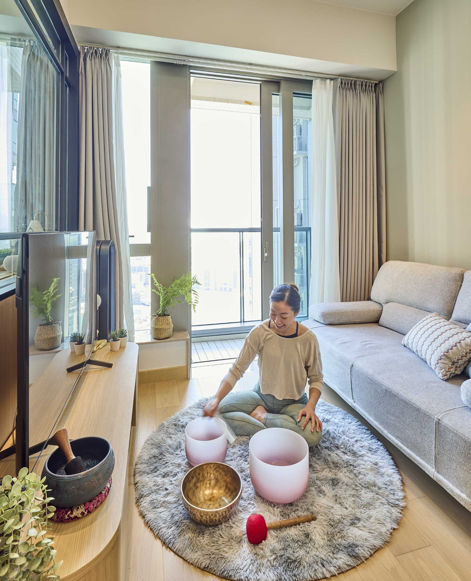 A small apartment with a living room flooded with natural light.