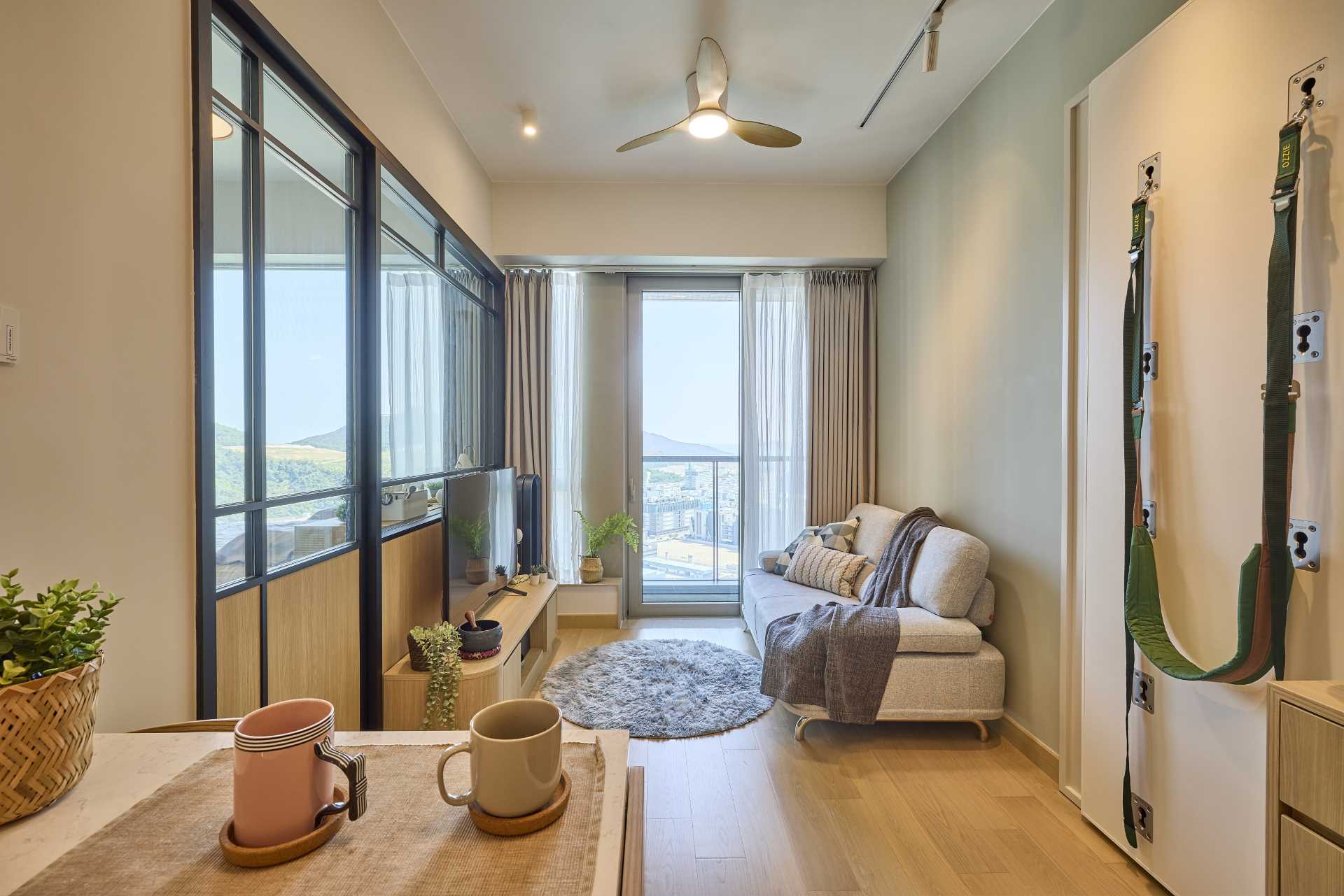 A small apartment with a living room flooded with natural light.