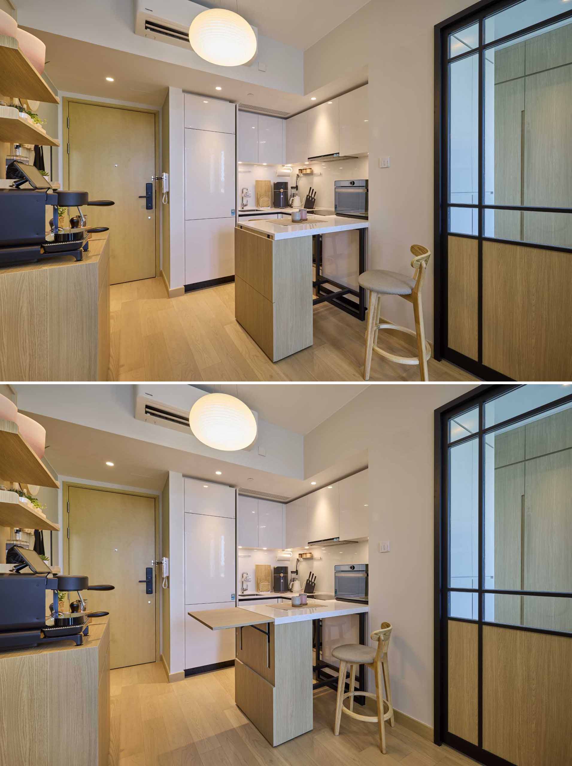 In this small apartment, a movable drop-leaf table of the same height as the cabinets acts as an extension of the countertop for food preparation