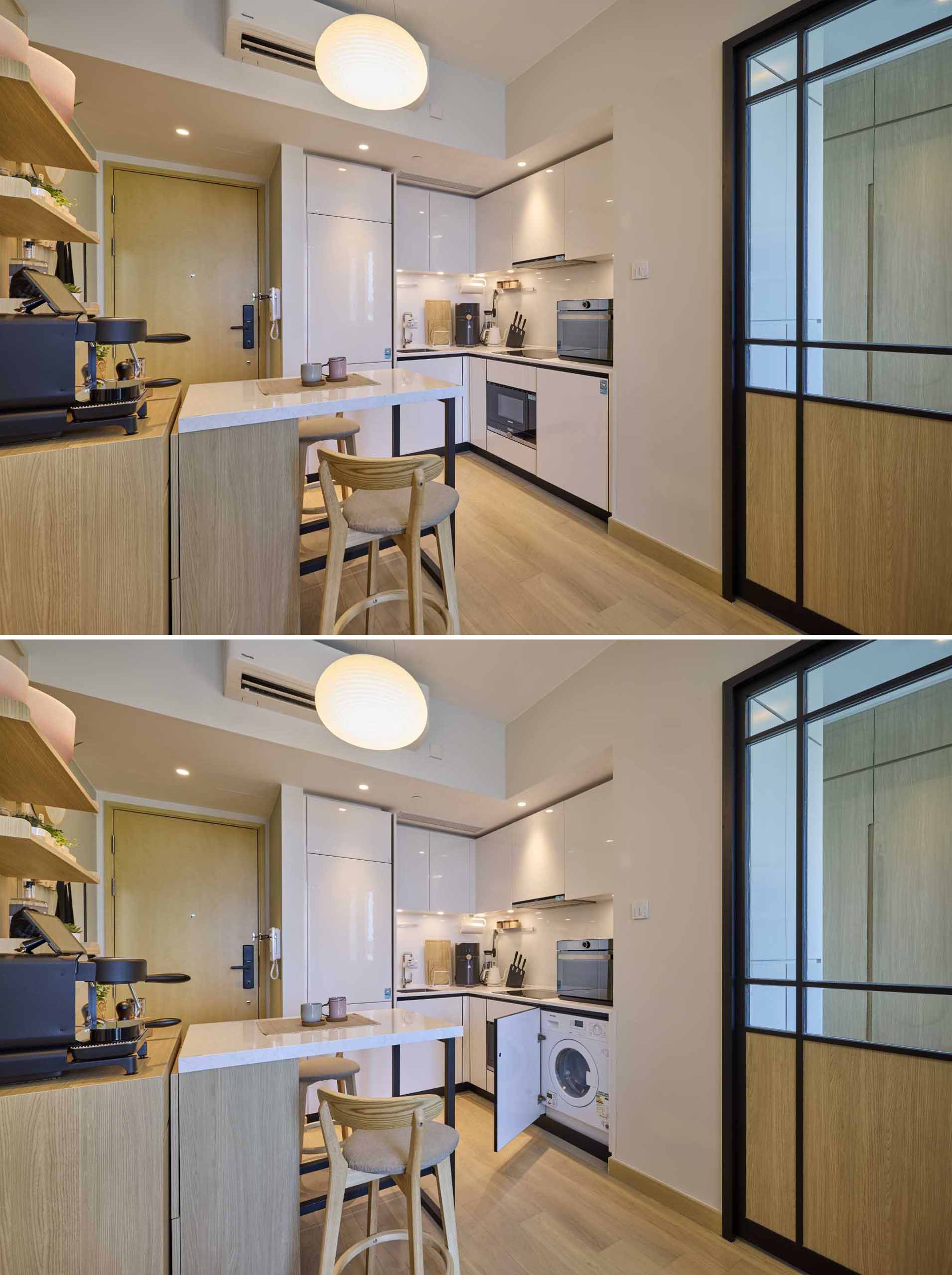A small island can be moved to expose the washing machine in this kitchen.