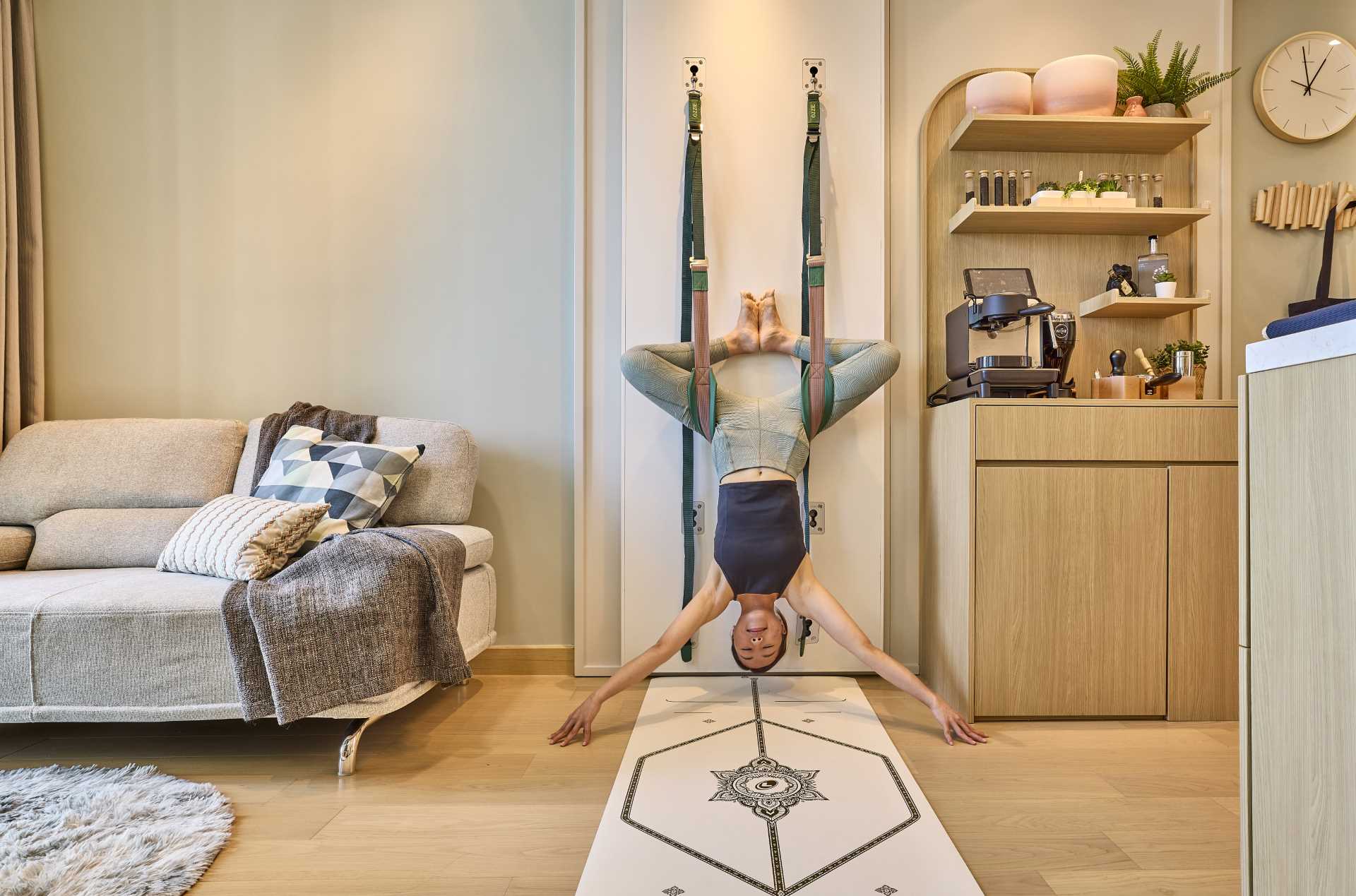 A small and modern apartment in Hong Kong includes a yoga wall and coffee bar.