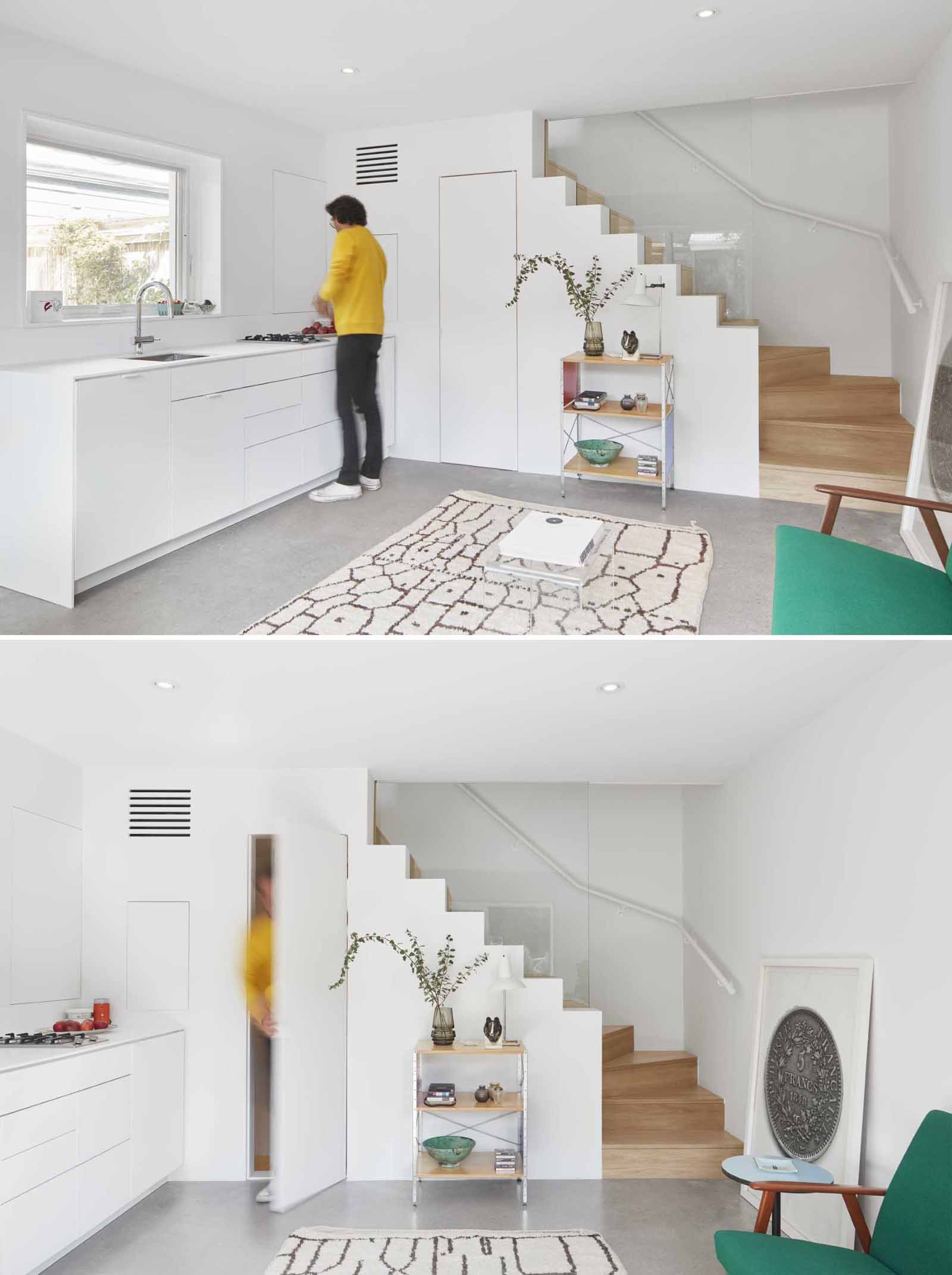 In this small laneway house and adjacent to the kitchen, is a bathroom door that almost blends into the wall. 