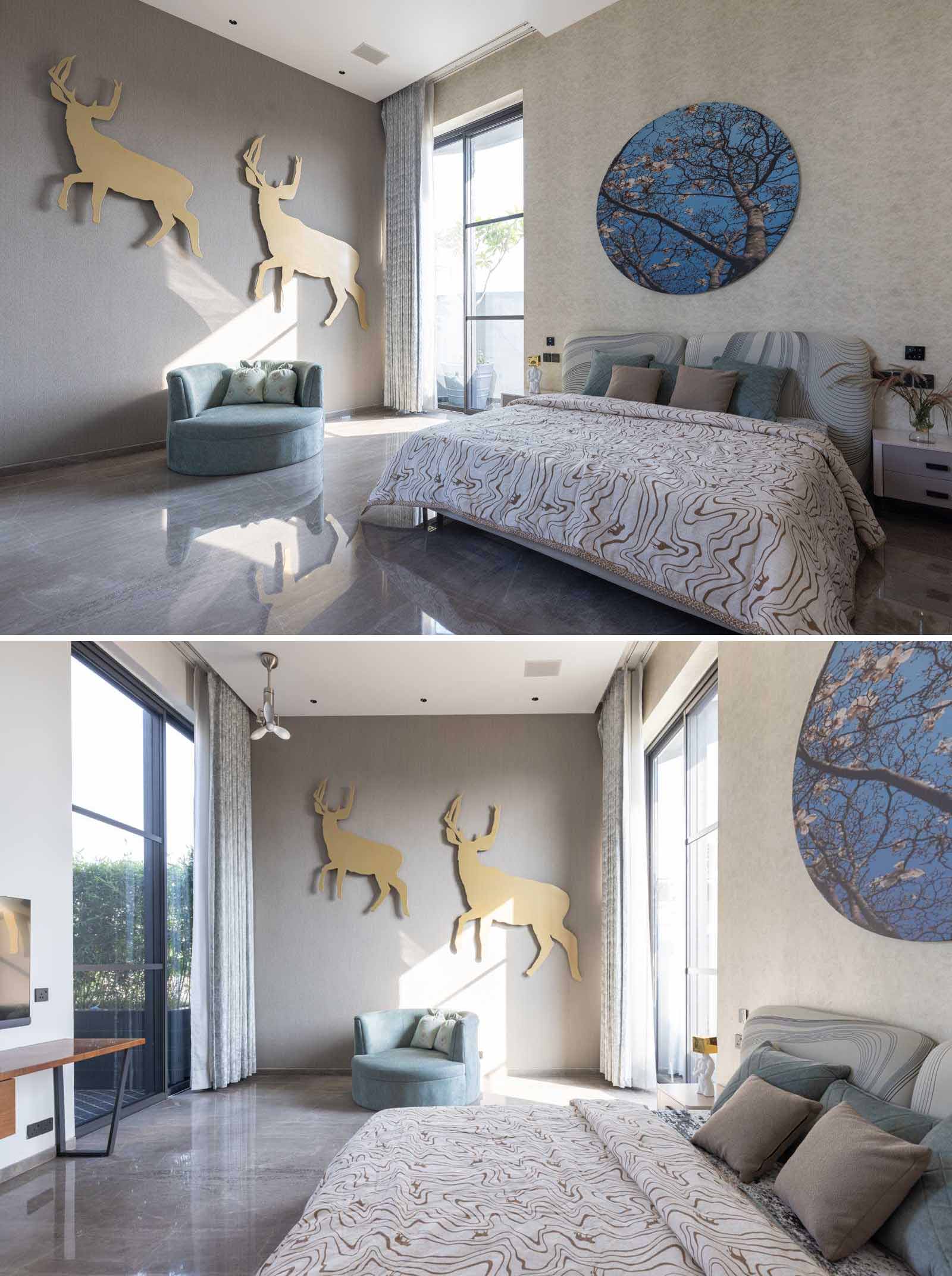 A contemporary bedroom with large art pieces.