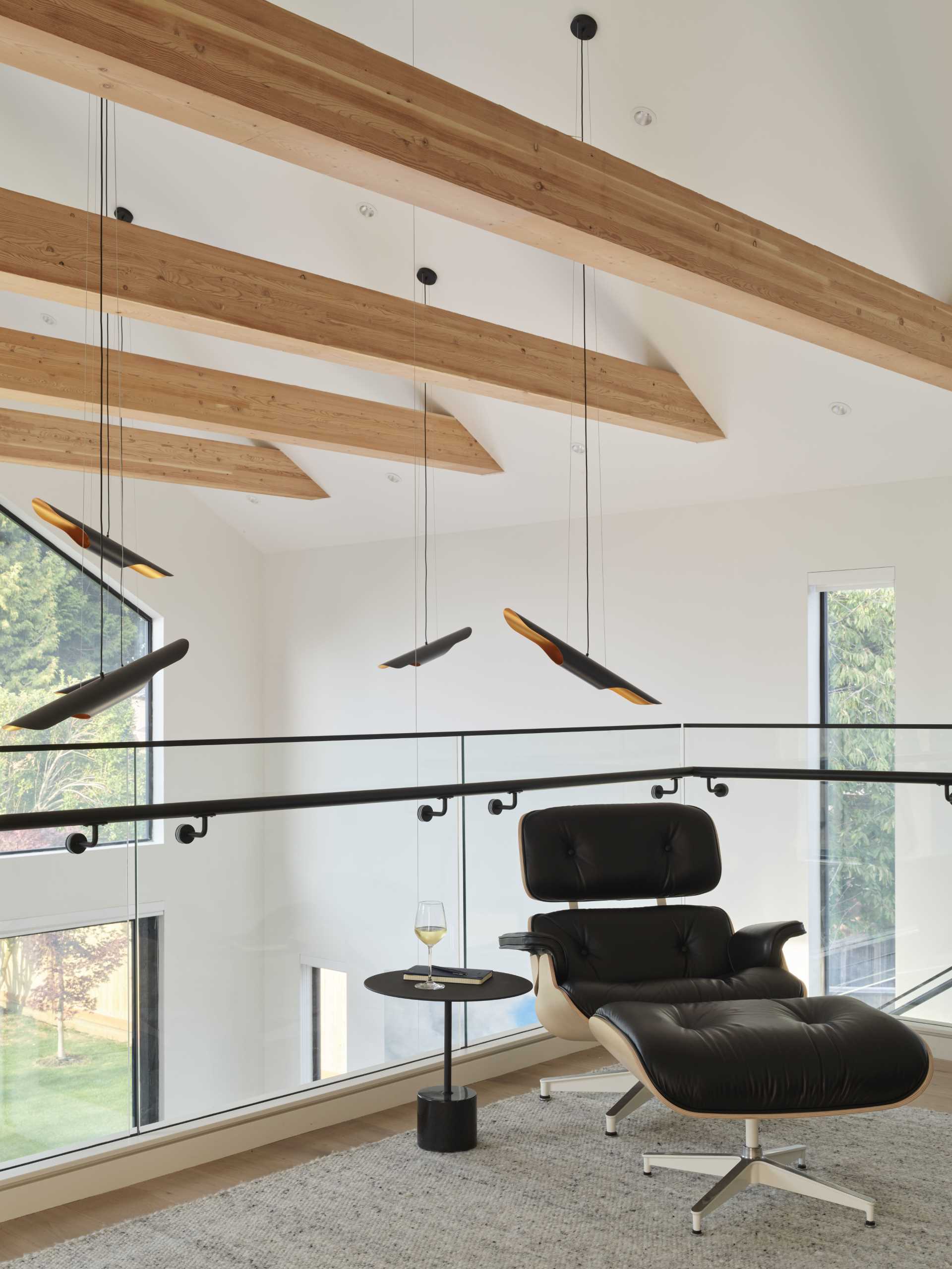 The mezzanine provides a place to relax and study while still feeling connected to the rest of this modern house.