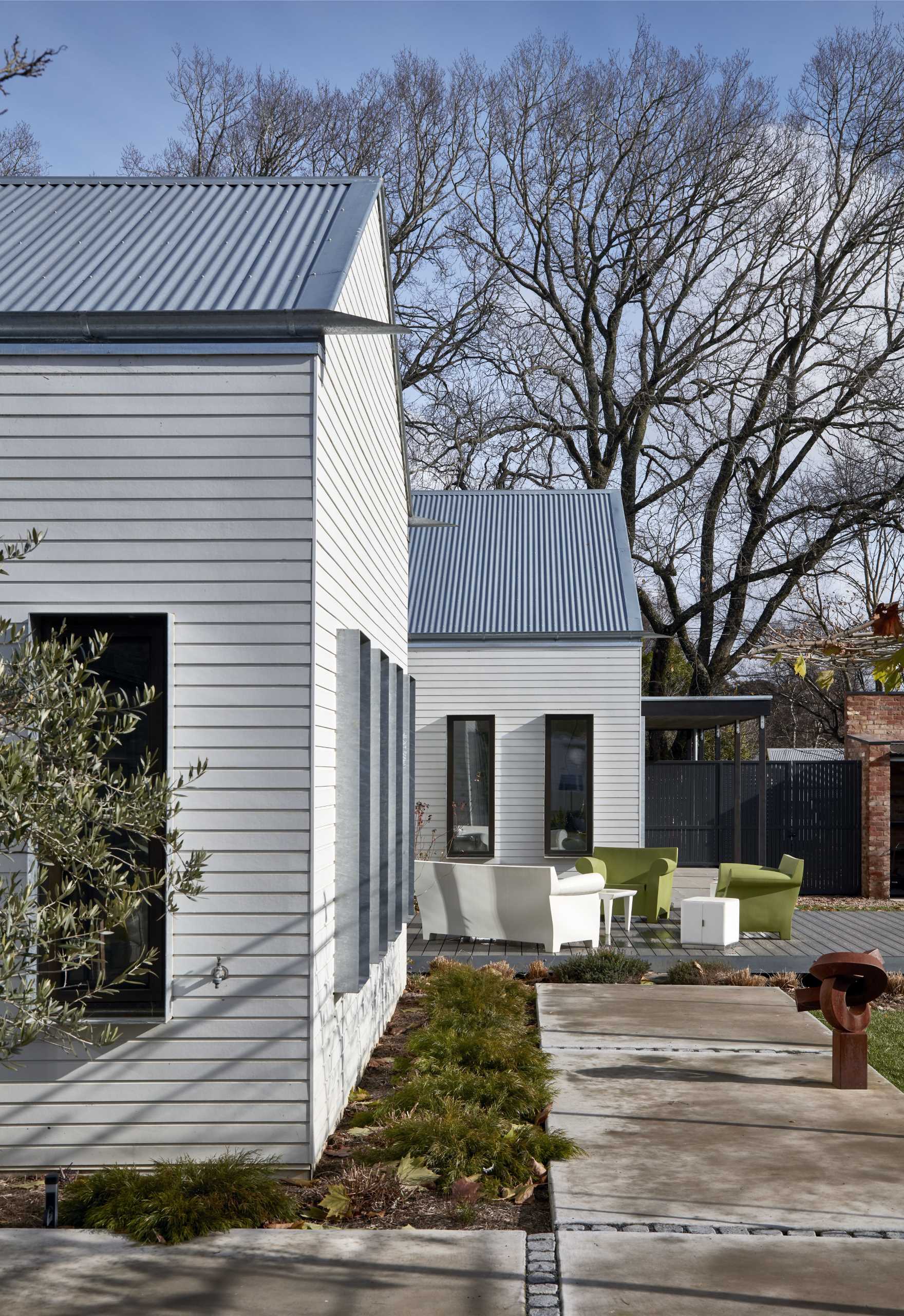 The home is a contemporary, stripped-back take on a classic double-fronted weatherboard house.