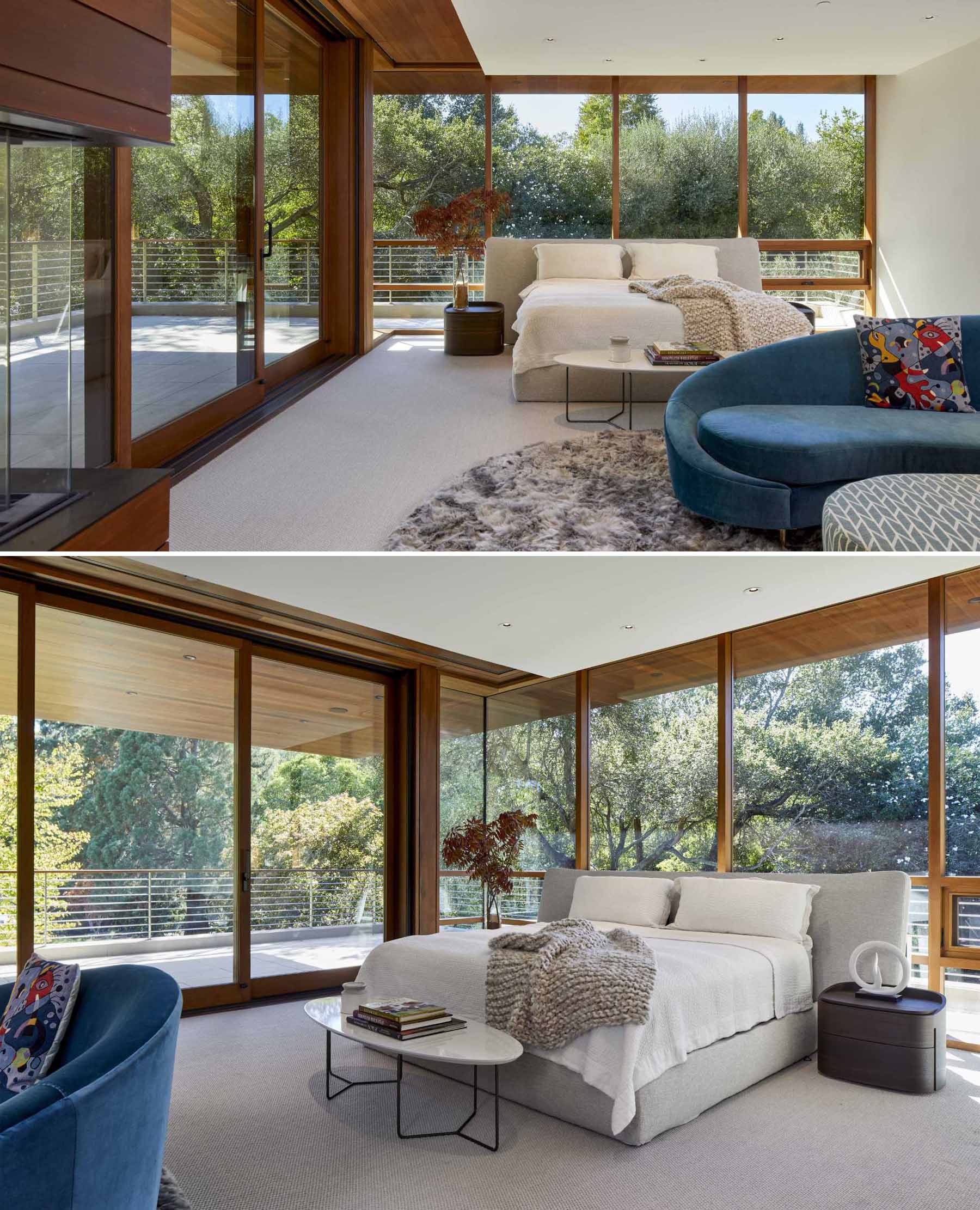 In this primary bedroom, glass walls provide a view of the trees, and a sliding glass door opens to a private balcony.