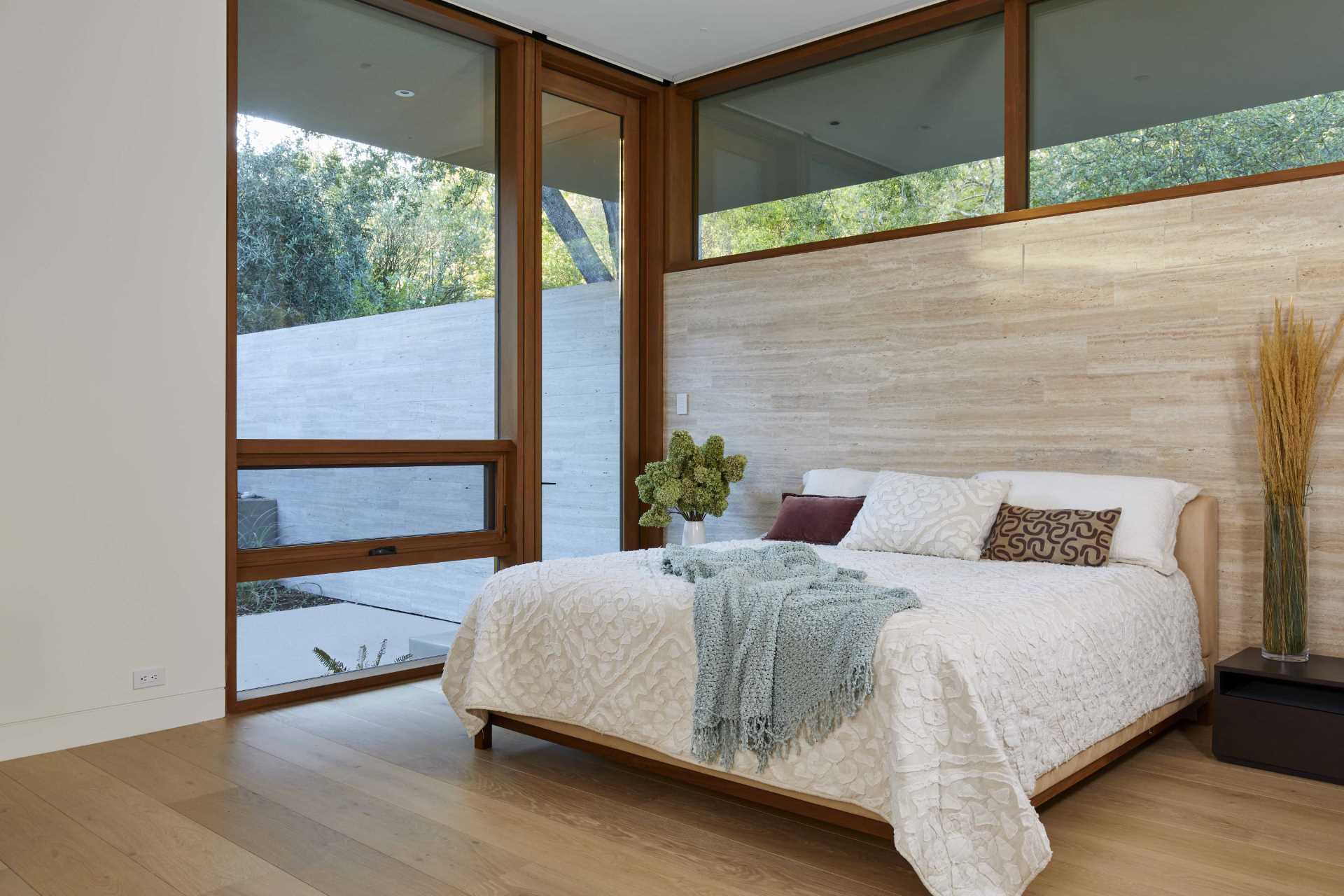 A modern neutral color palette in this bedroom makes for a relaxing space.