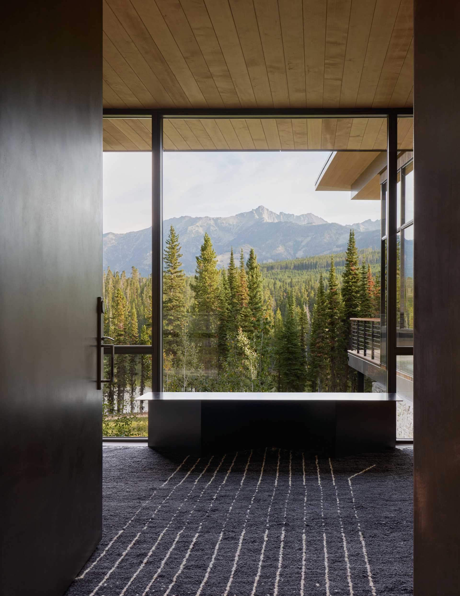 Large windows showcase the mountain views in this contemporary home.