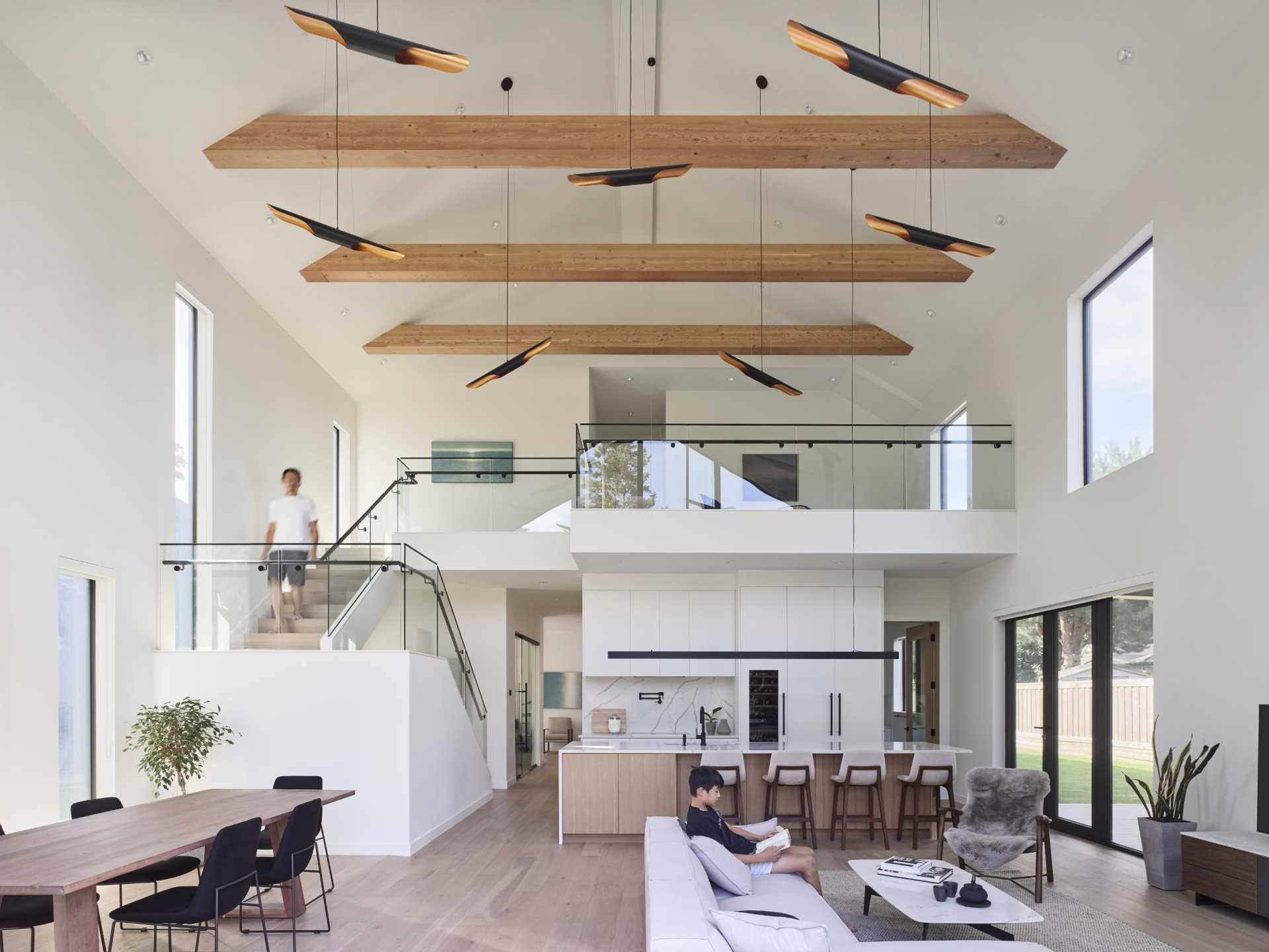The main living space, which includes the living, dining, and kitchen area, features a vaulted ceiling that reaches a peak height of 25 feet (7m).