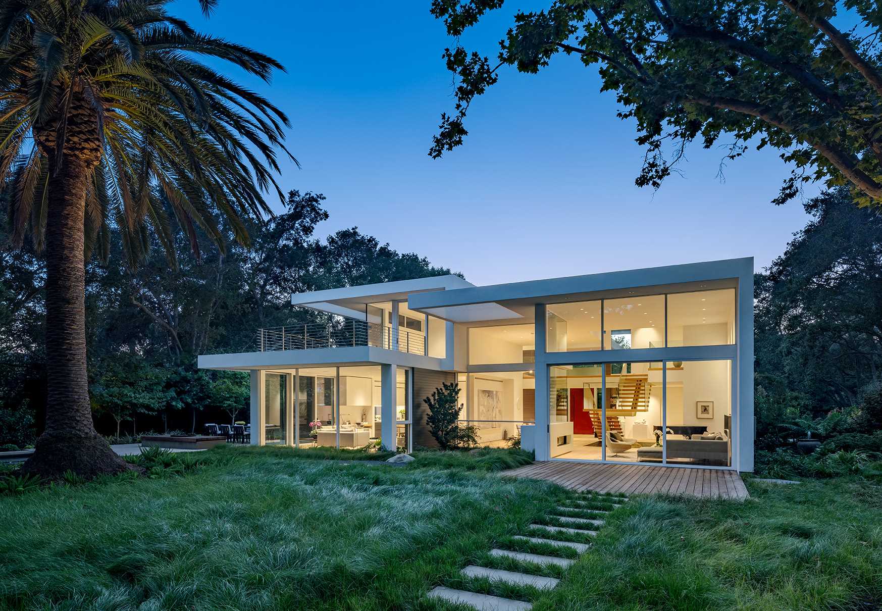 During the day, the large windows allow the natural daylight to filter through to the interior of this modern home.