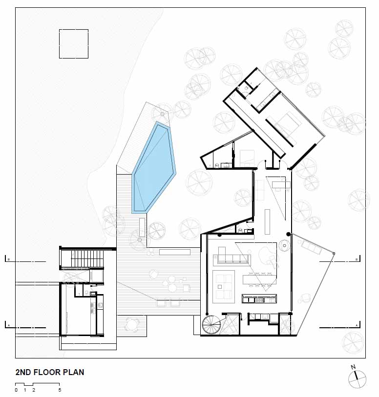 The floor plan of a modern house on stilts.