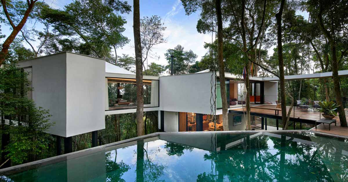 This Modern House Sits On Top Of Stilts In The Forest