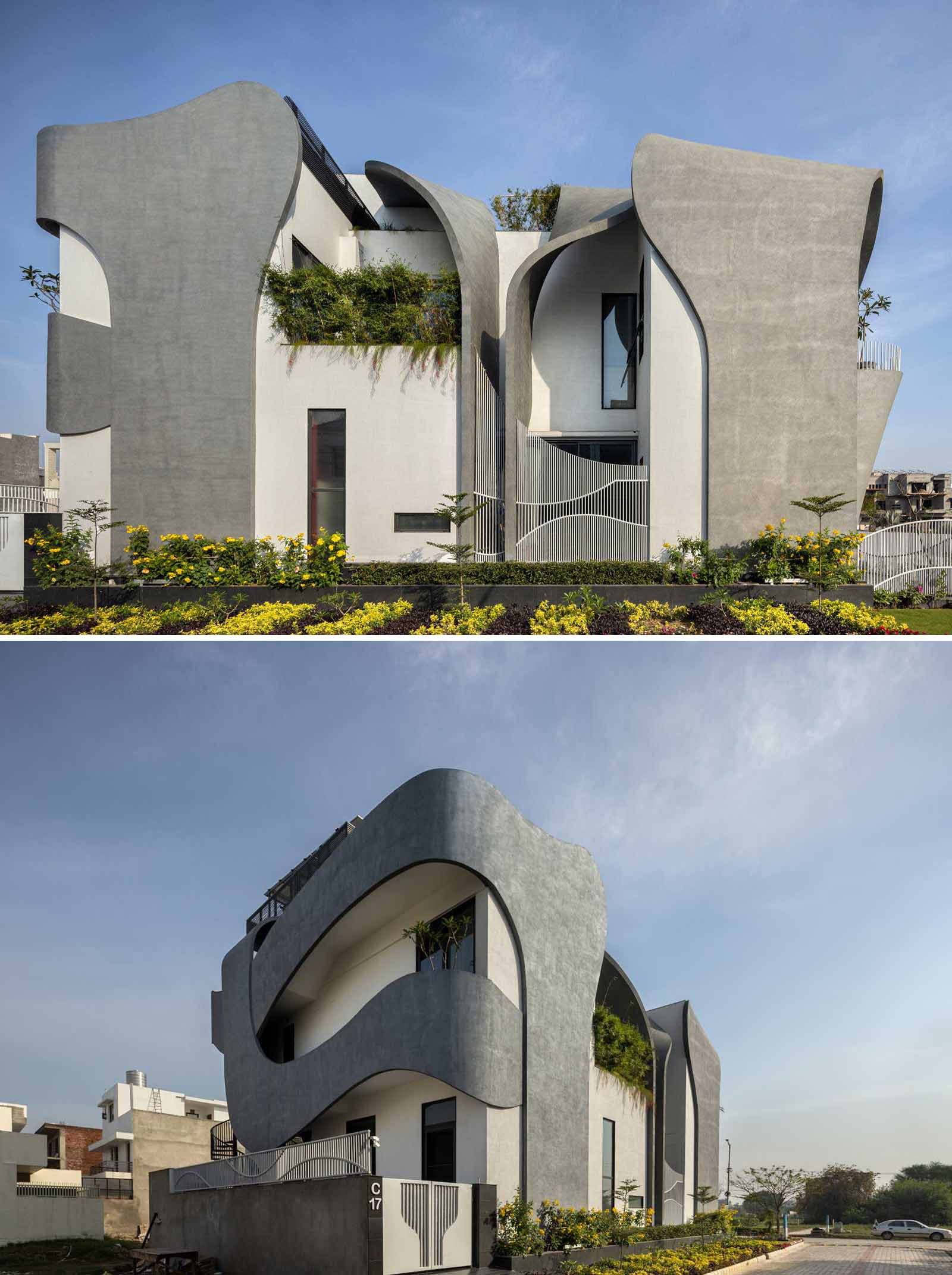 A modern house with a sculptural facade that features ribbon-inspired free-flowing concrete.