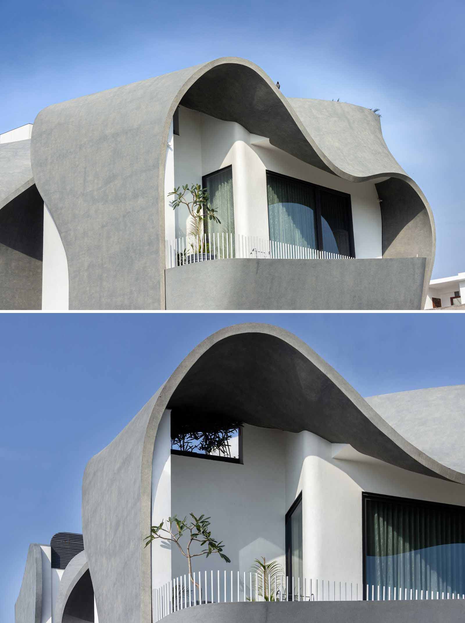 A modern house with a sculptural facade that features ribbon-inspired free-flowing concrete.