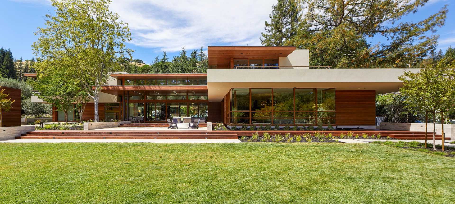 A key design element of this home is the H-shaped layout with an exterior clad in Western Red Cedar siding.