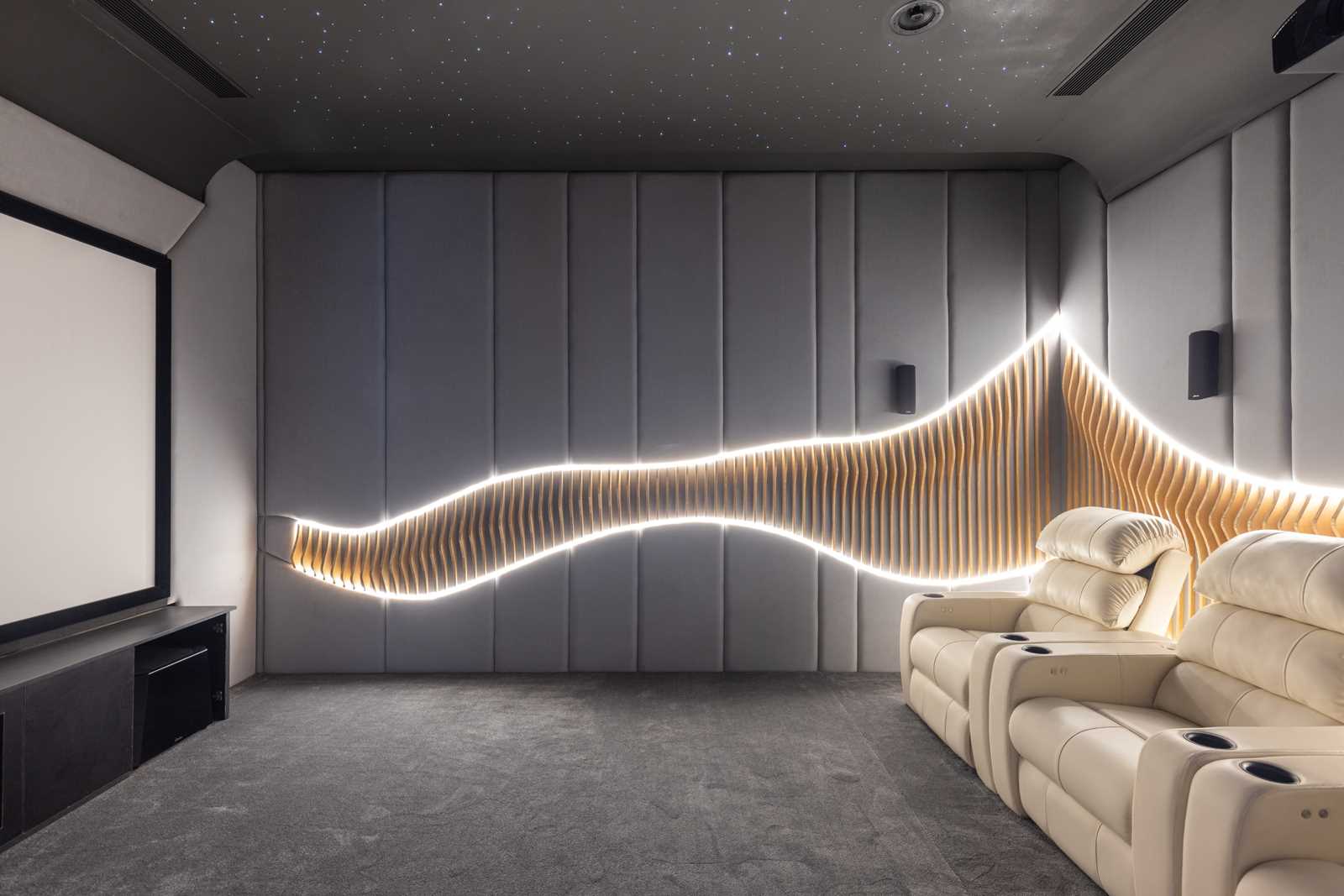 In this media room, the upholstered walls are punctuated by wooden ribs and LED lighting.