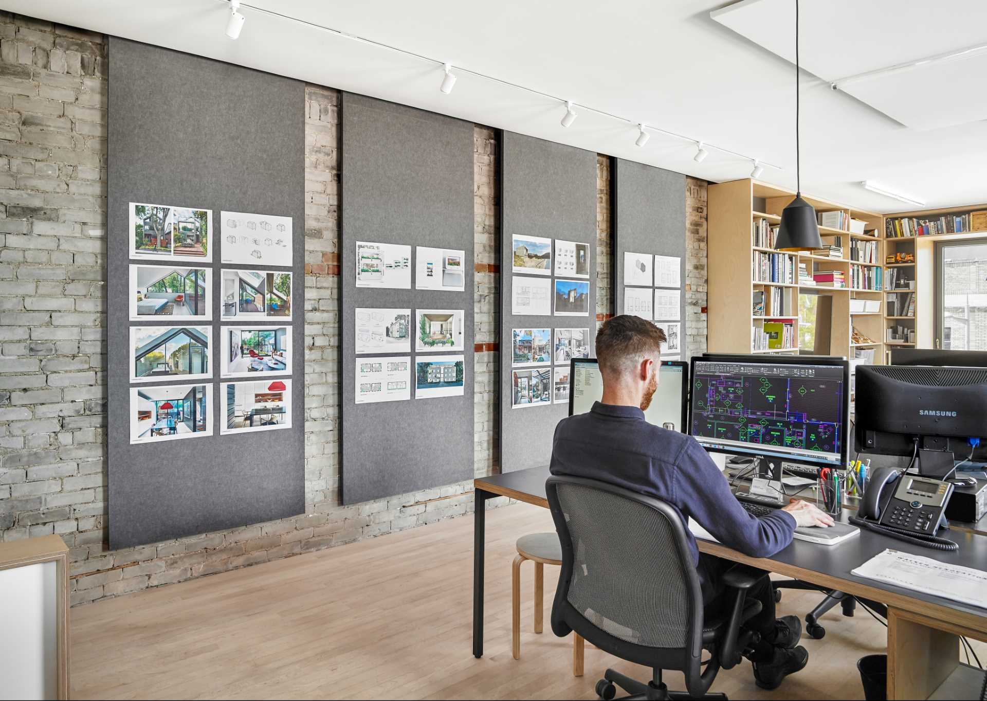 A modern office with felt panels that help with the acoustics in the space.