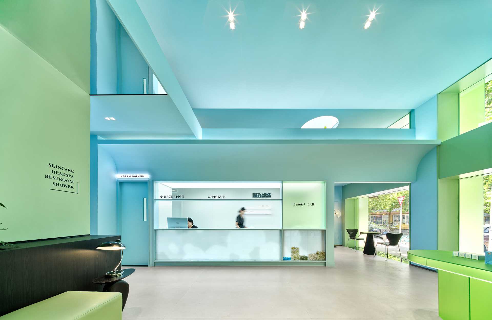 Making use of the high ceilings, the designers of this skincare center created a faux second floor, allowing storage and access for air conditioning duct maintenance.