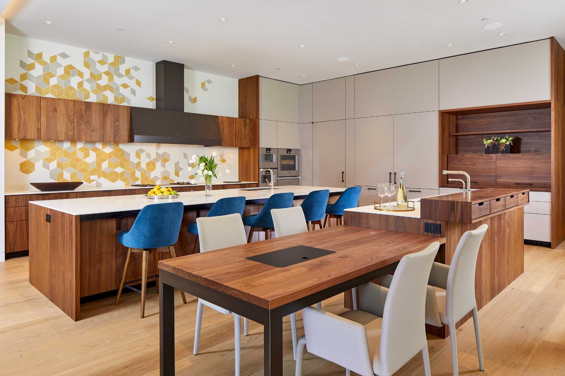 A modern kitchen with wood accents and a patterned backsplash.