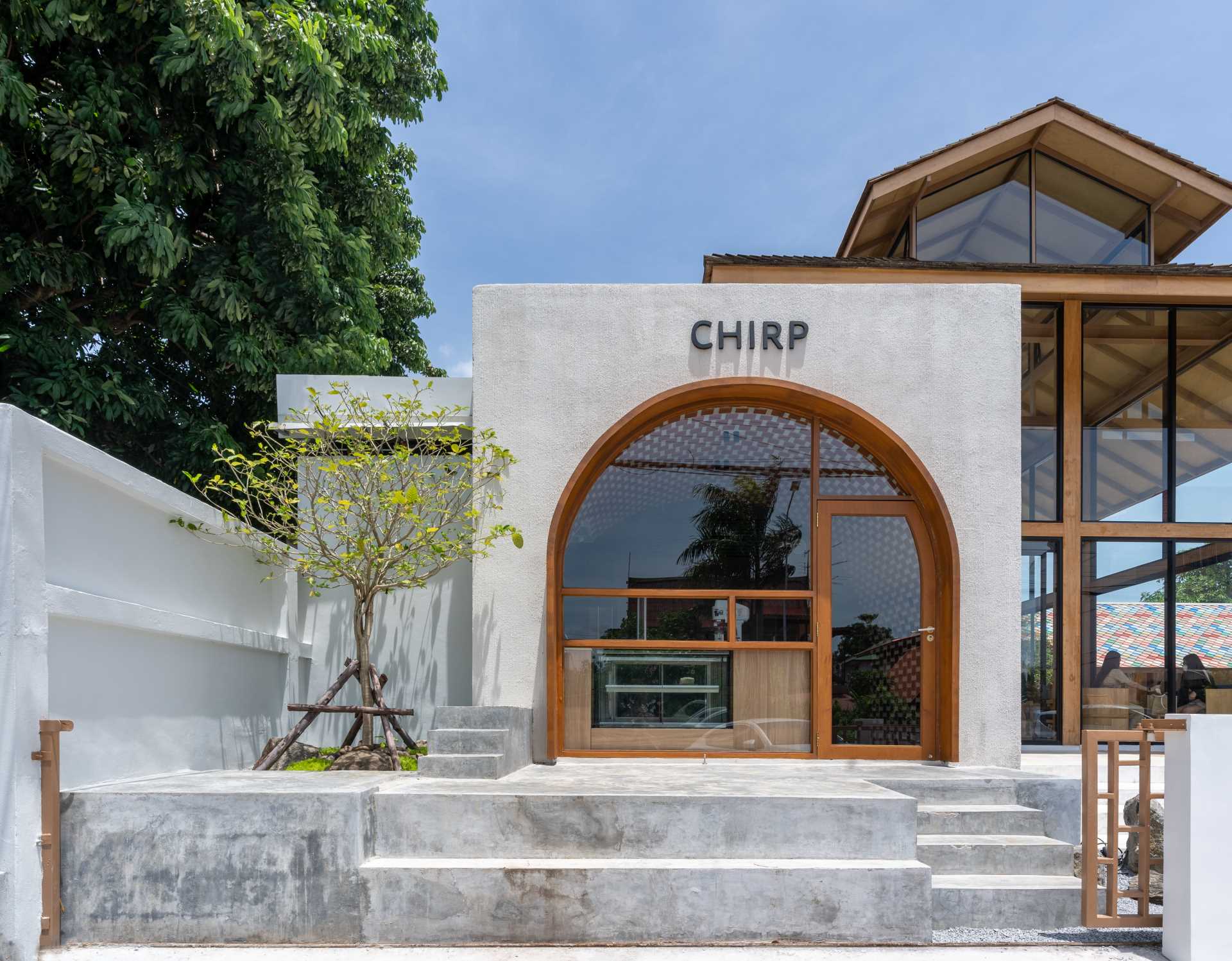 The Large Arch Window In Front Of This Cafe Offers A Glimpse Of