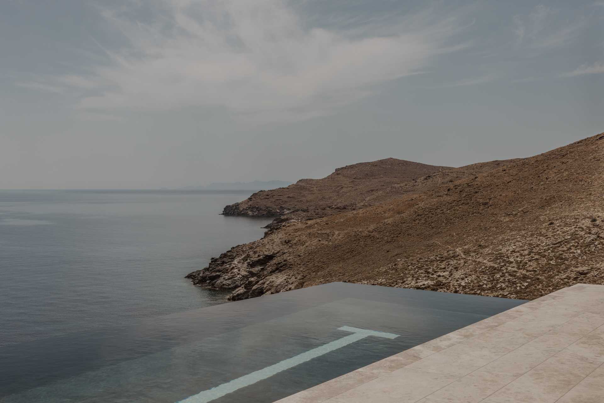 A swimming pool with an infinity edge provides a place to cool off with uninterrupted views of the Mediterranean Sea.