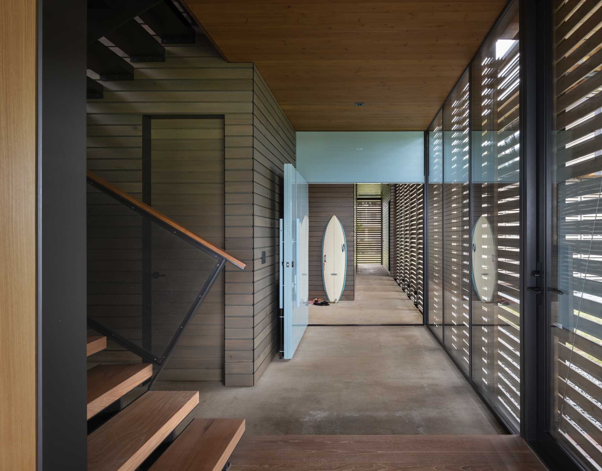 A modern home with wood and metal stairs.