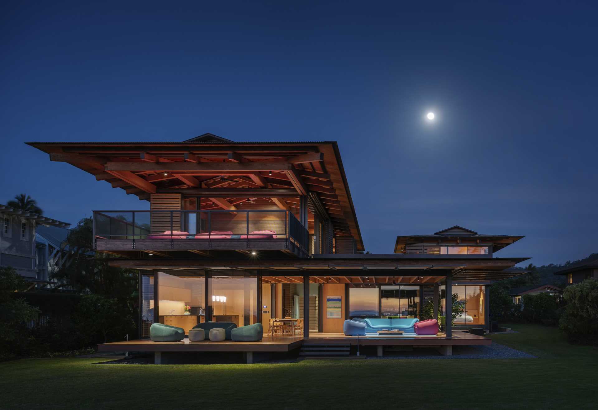 Wooden floors extend from the living room to an exterior lanai that floats like a raft above the landscape.