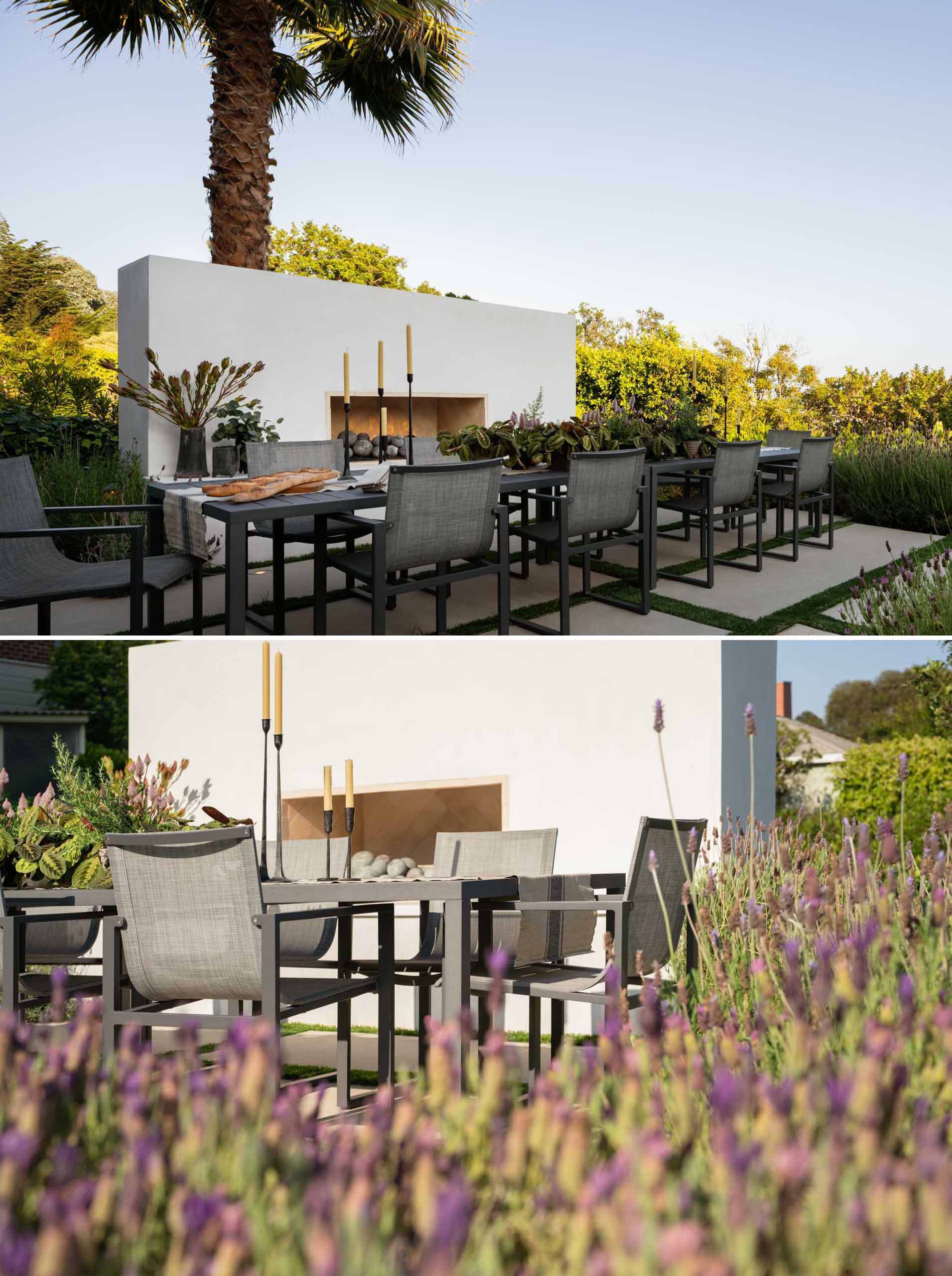 An al fresco dining area framed by fragrant lavender with the soothing sound of a cascading fountain and the warmth from an outdoor fireplace.