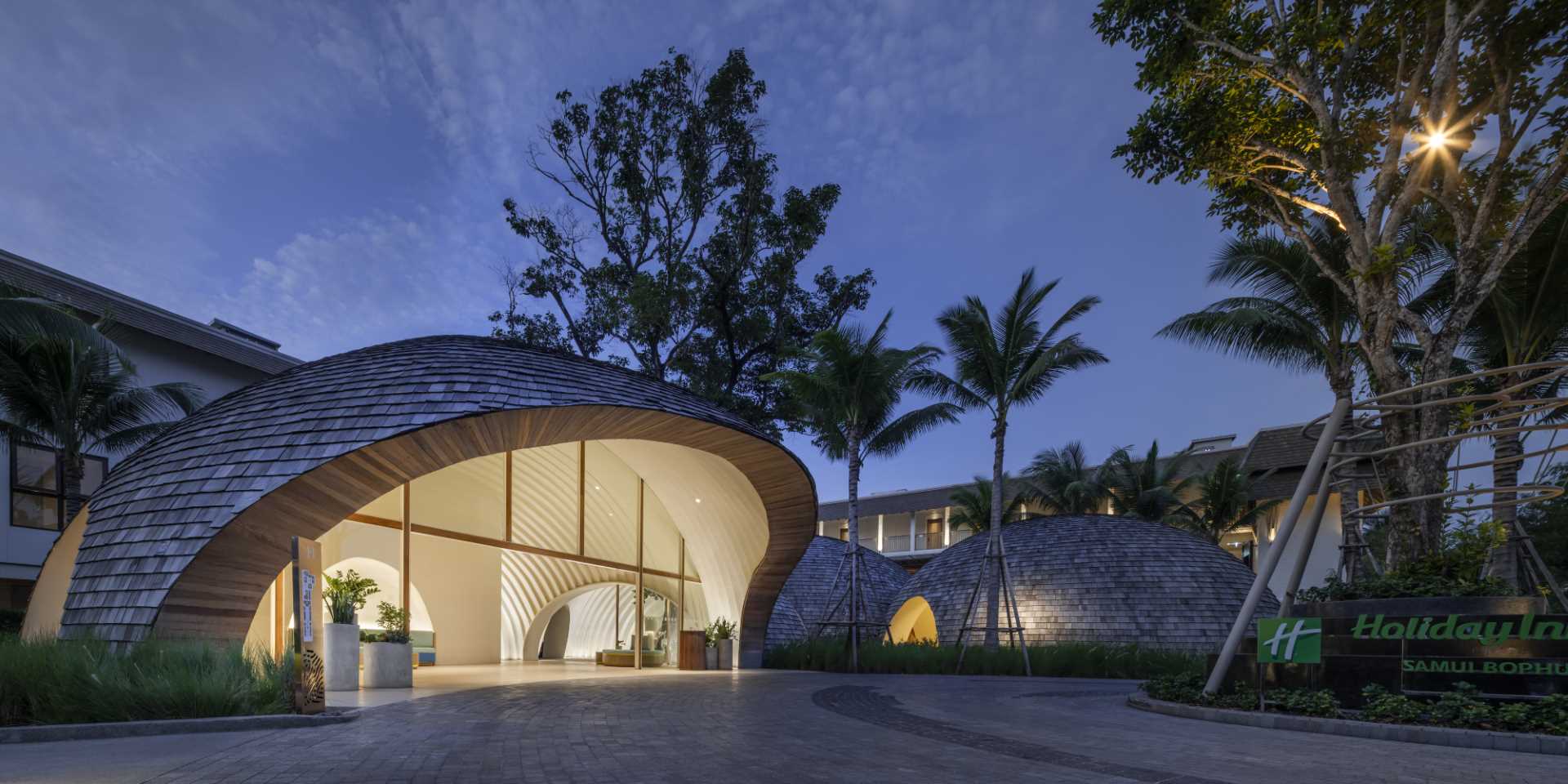 A modern hotel lobby whose design is inspired by the shape and interior of a coconut.