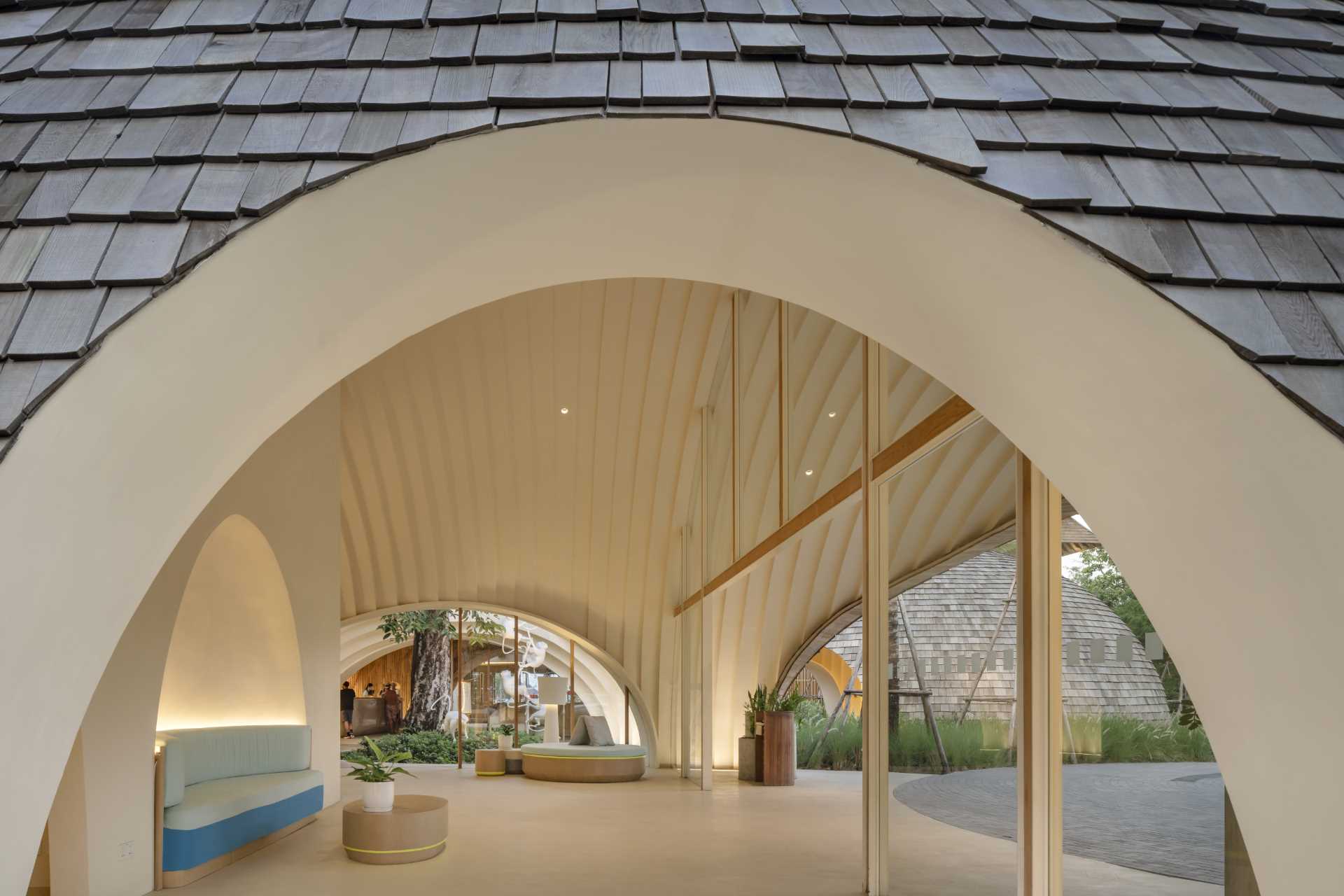 A modern hotel lobby whose design is inspired by the shape and interior of a coconut.