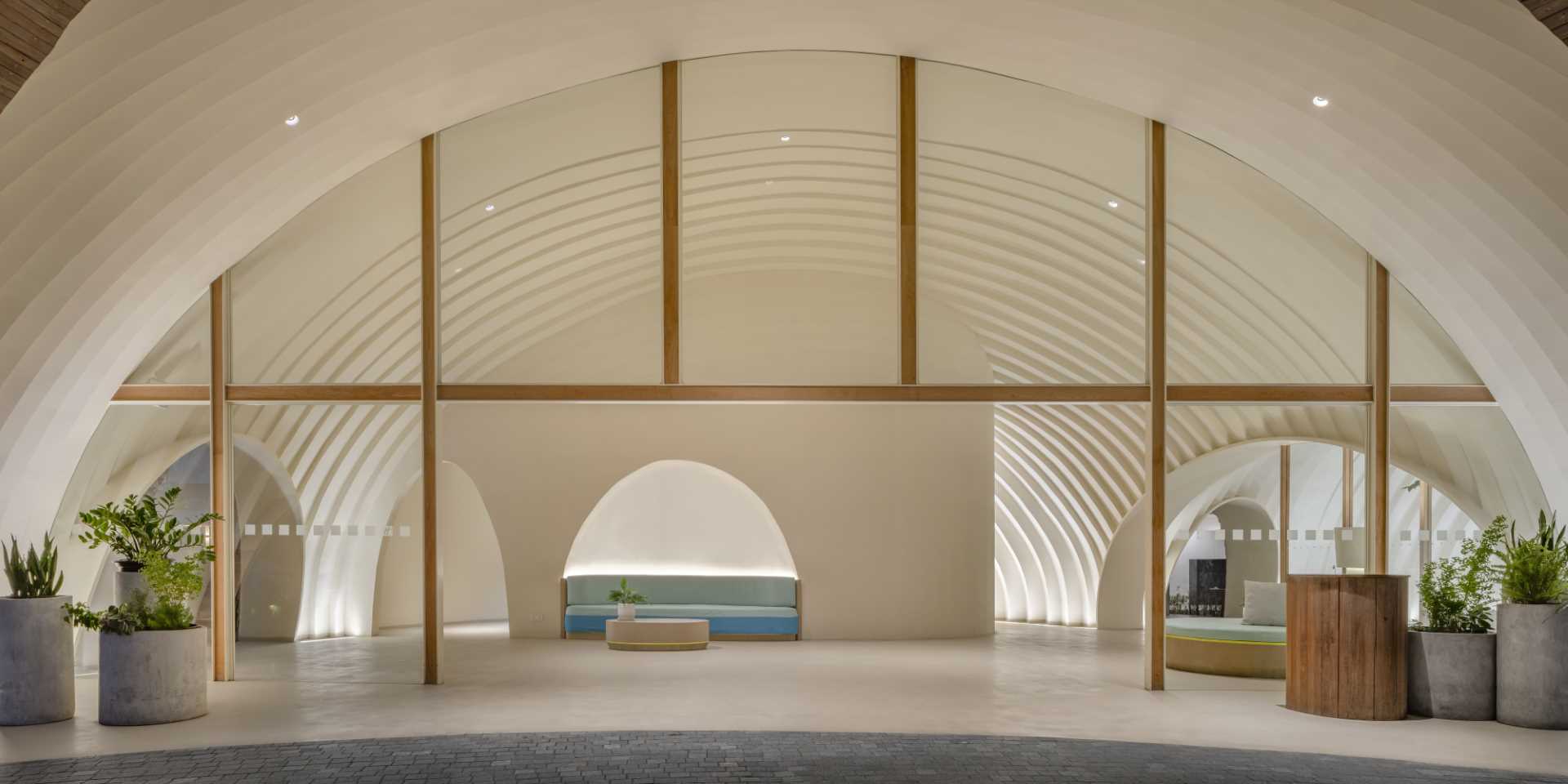 A modern hotel lobby with a curved design.