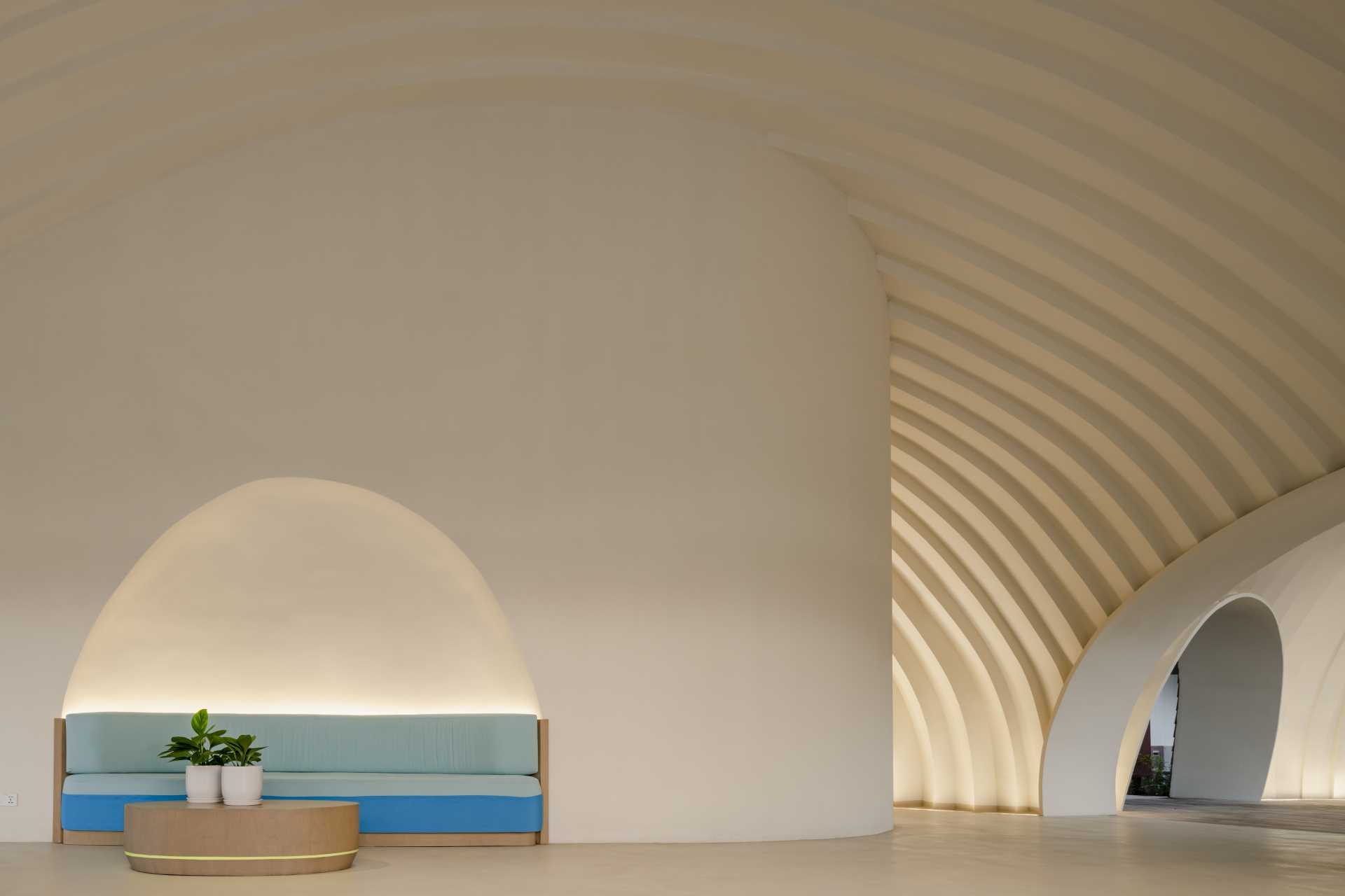A modern hotel lobby with a curved design.