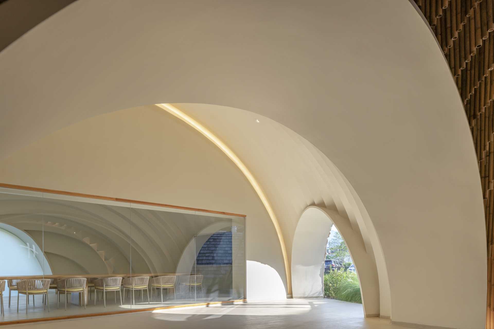 A glass-enclosed conference room that enjoys views of the curved interior.