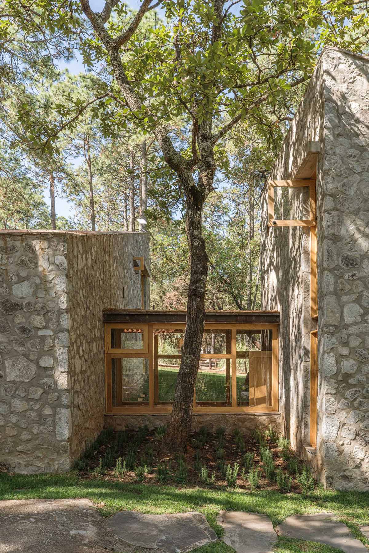 A contemporary stone, wood, and glass home.