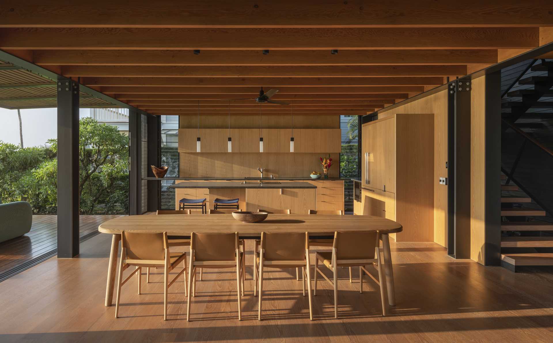 Japanese birch wall paneling and wood floors throughout the home add a connection with nature, as well as provide a neutral backdrop