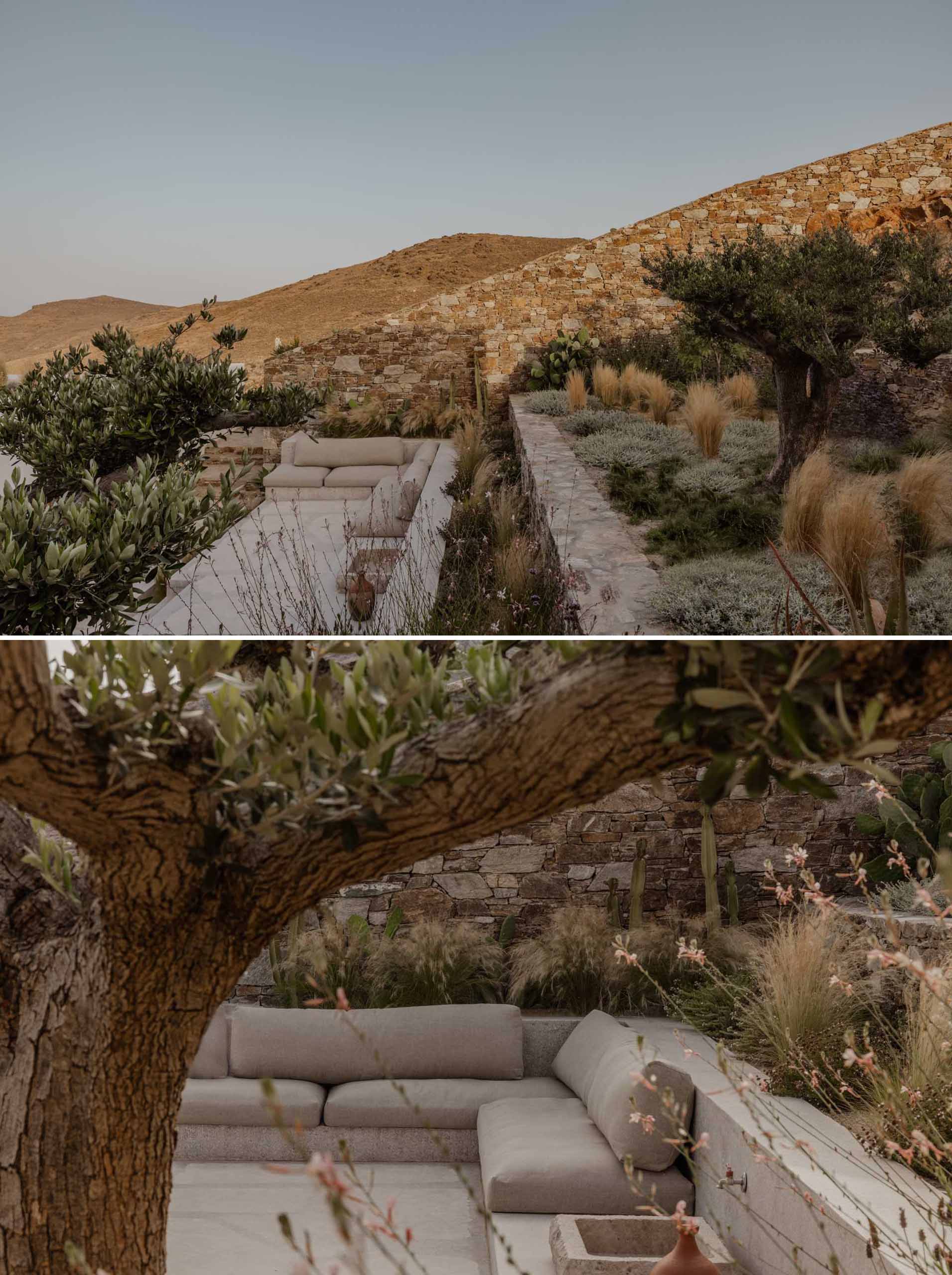 A modern terrace built into the hillside includes a lounge area.