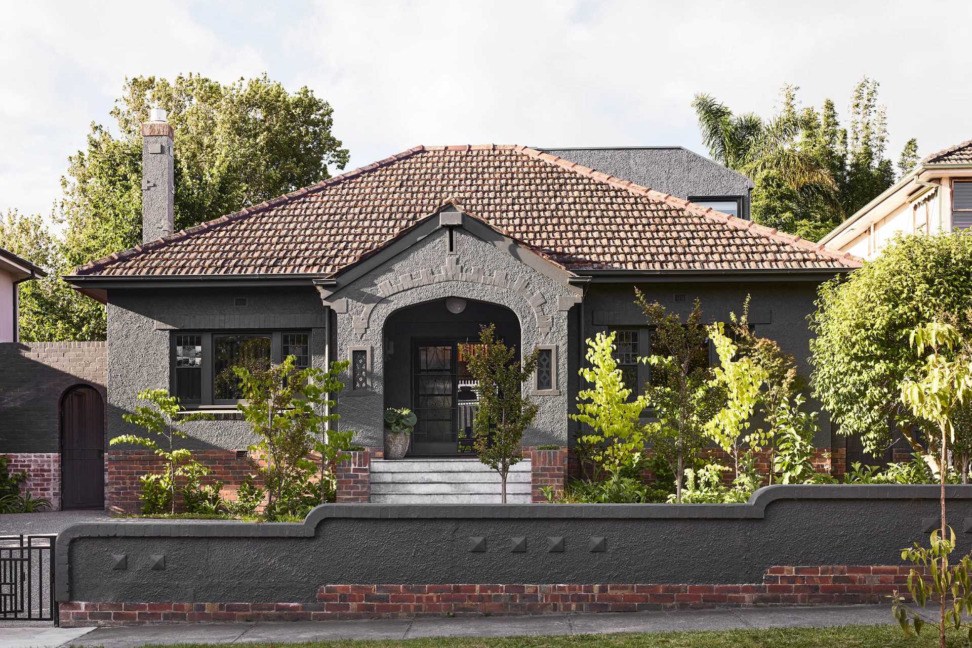 An Australian home with a grey and brick exterior.