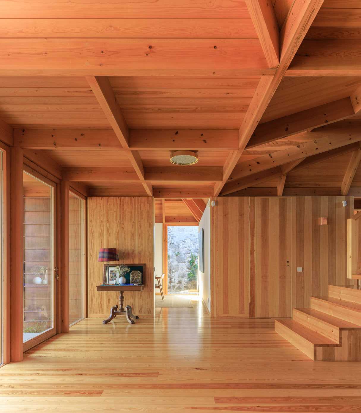 A modern entryway lined with wood.